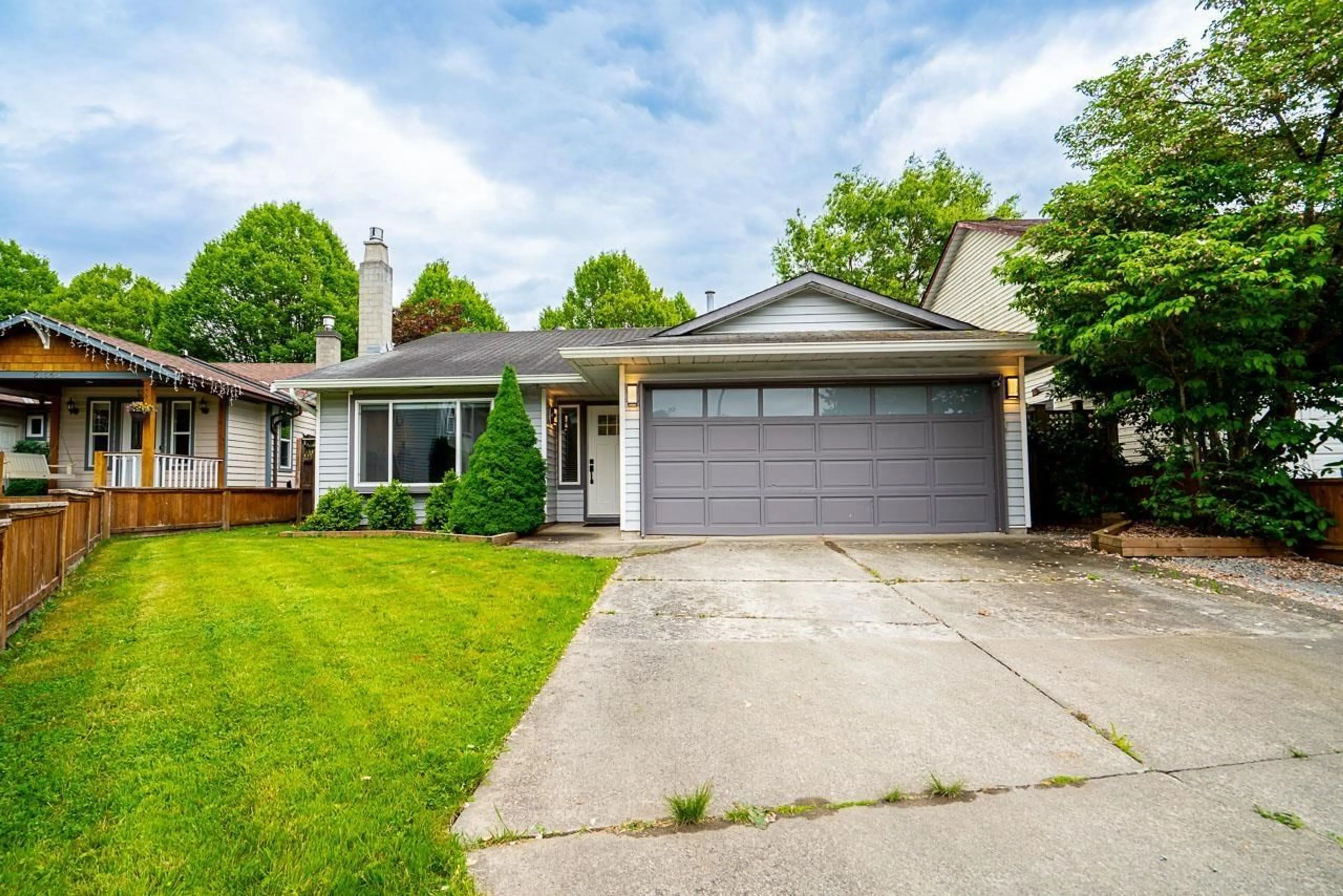 Home with vinyl exterior material, street for 21579 94A AVENUE, Langley British Columbia V1M2A5
