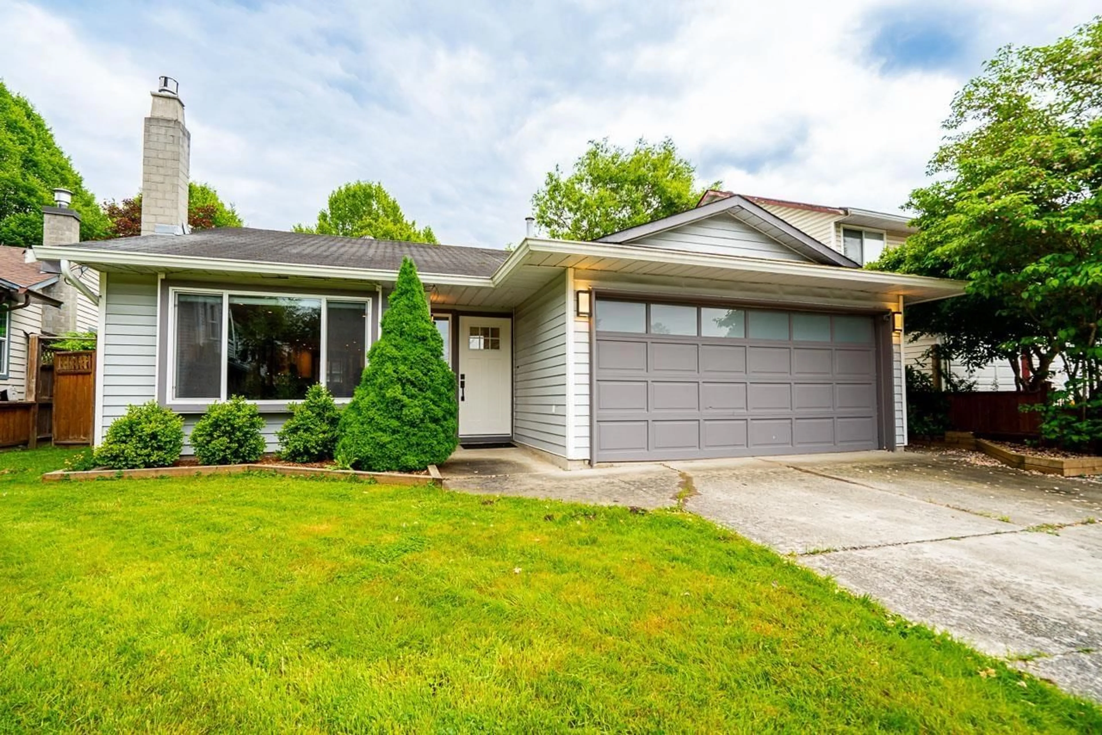 Home with vinyl exterior material, street for 21579 94A AVENUE, Langley British Columbia V1M2A5