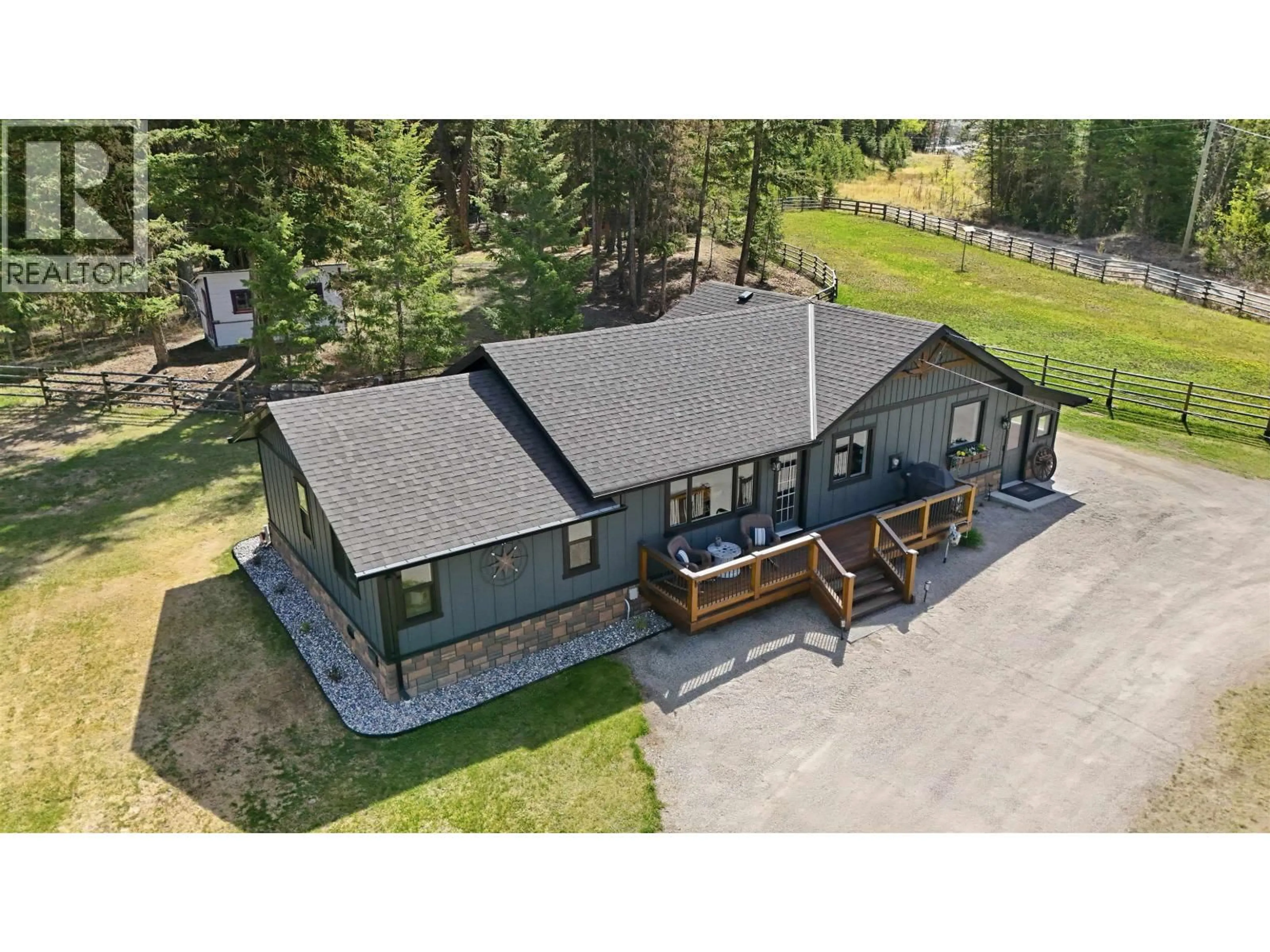 A pic from outside/outdoor area/front of a property/back of a property/a pic from drone, unknown for 240 LIKELY ROAD, 150 Mile House British Columbia V0K2G0