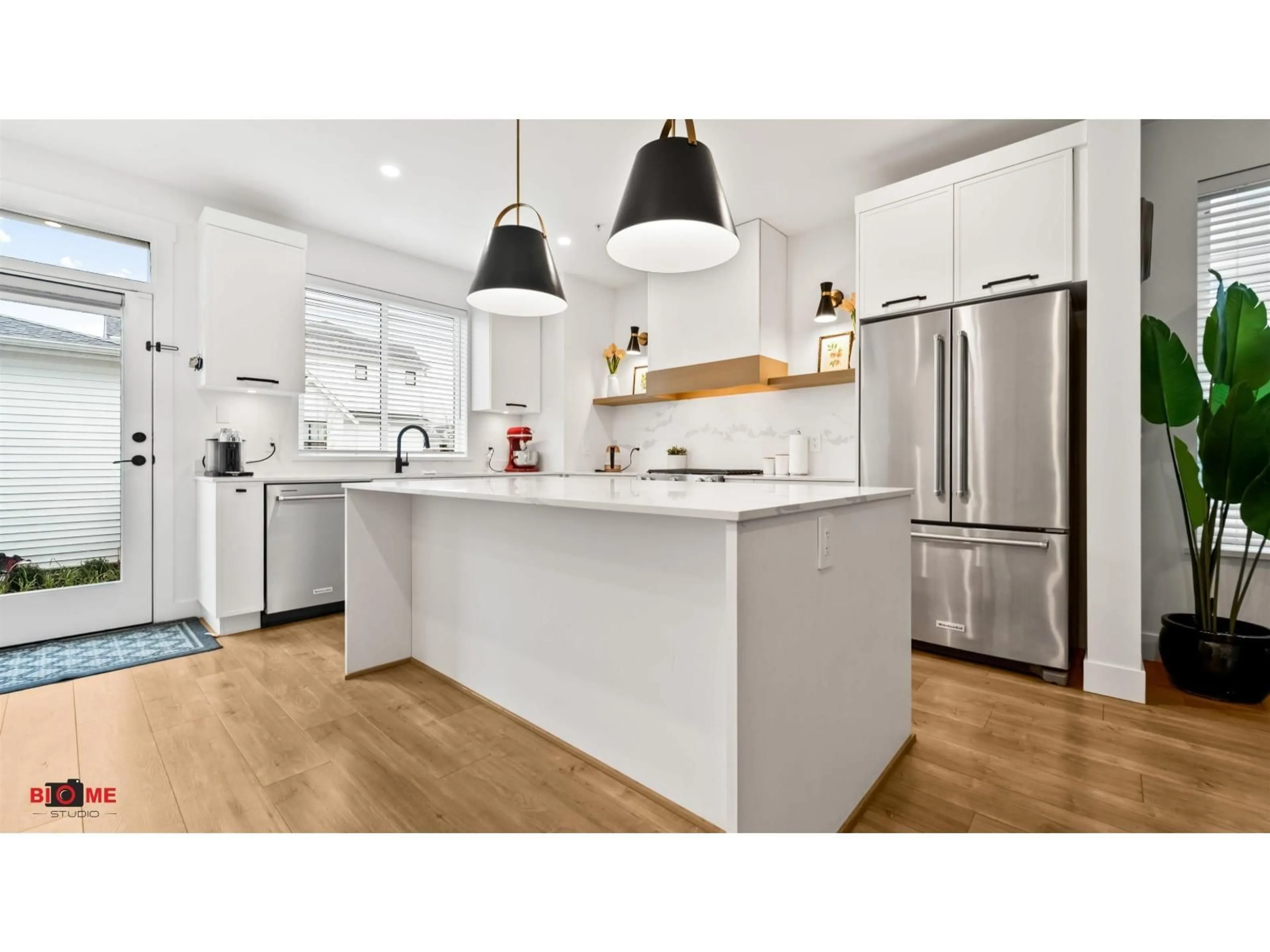 Open concept kitchen, wood/laminate floor for 7495 197 STREET, Langley British Columbia V2Y3T2