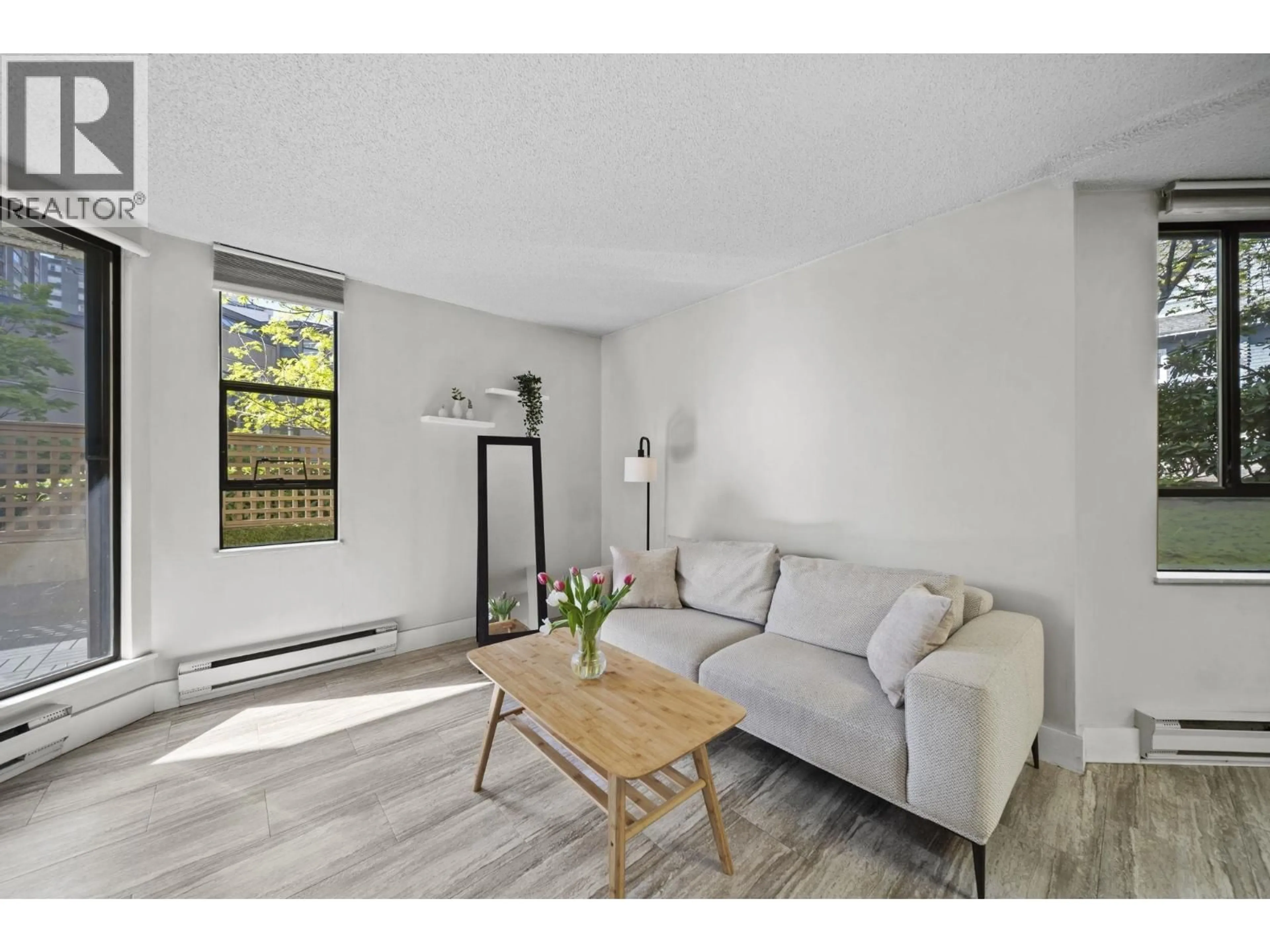 Living room with furniture, wood/laminate floor for 215 - 1080 PACIFIC STREET, Vancouver British Columbia V6E4C2