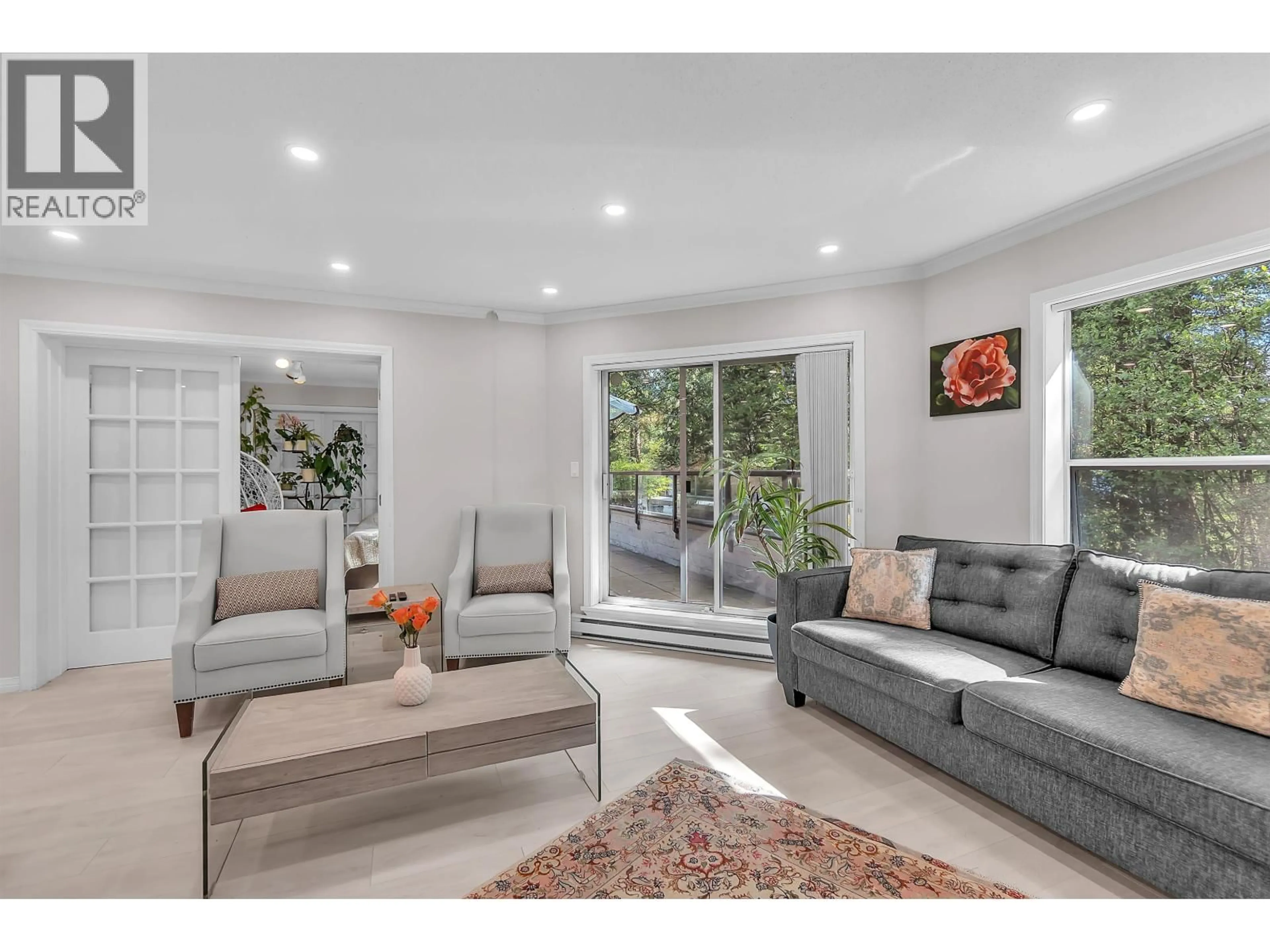 Living room with furniture, unknown for 207 - 1500 OSTLER COURT, North Vancouver British Columbia V7G2S2