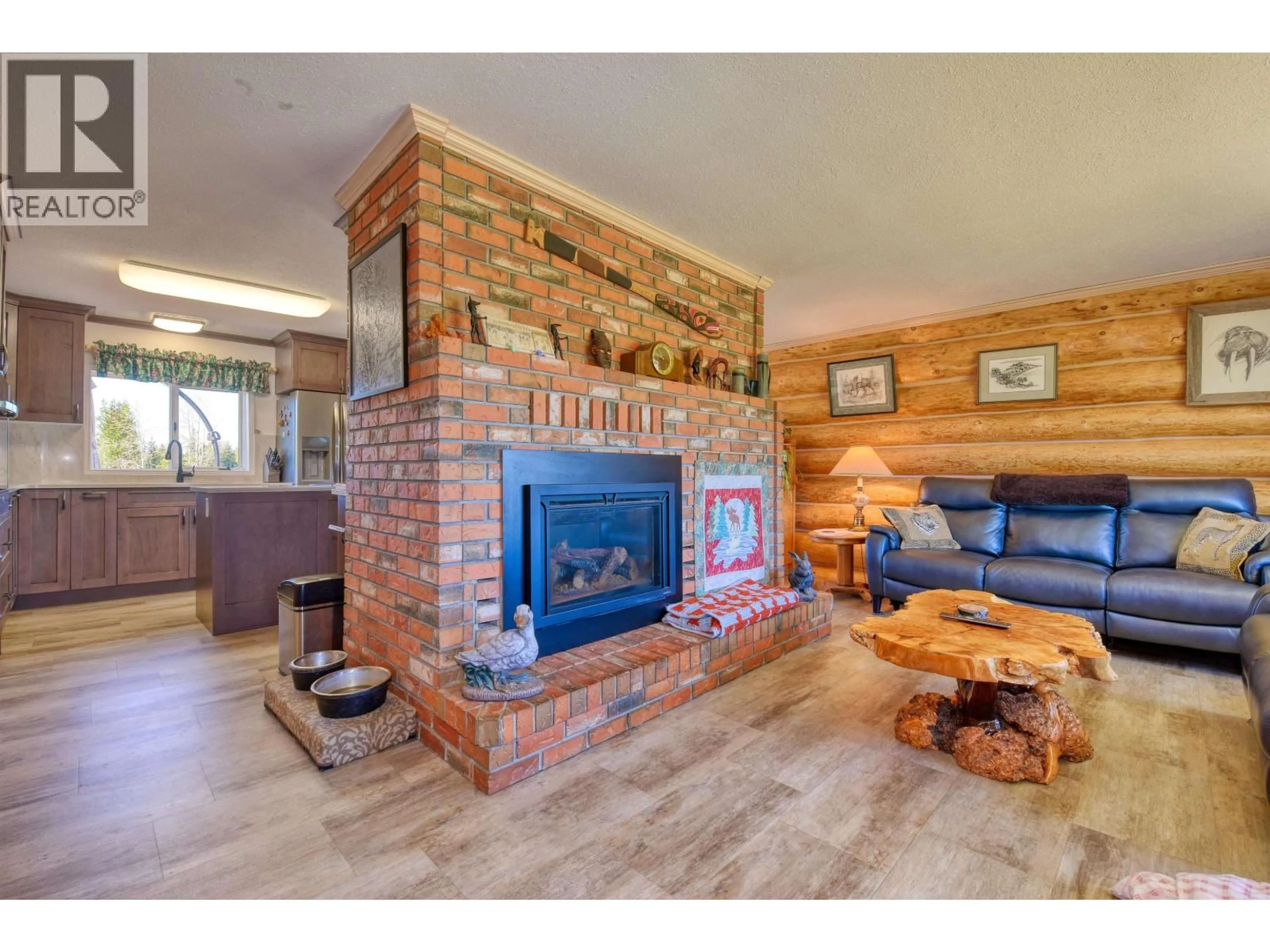 Living room with furniture, wood/laminate floor for 3574 SPOKIN LAKE ROAD, Williams Lake British Columbia V0K2G0