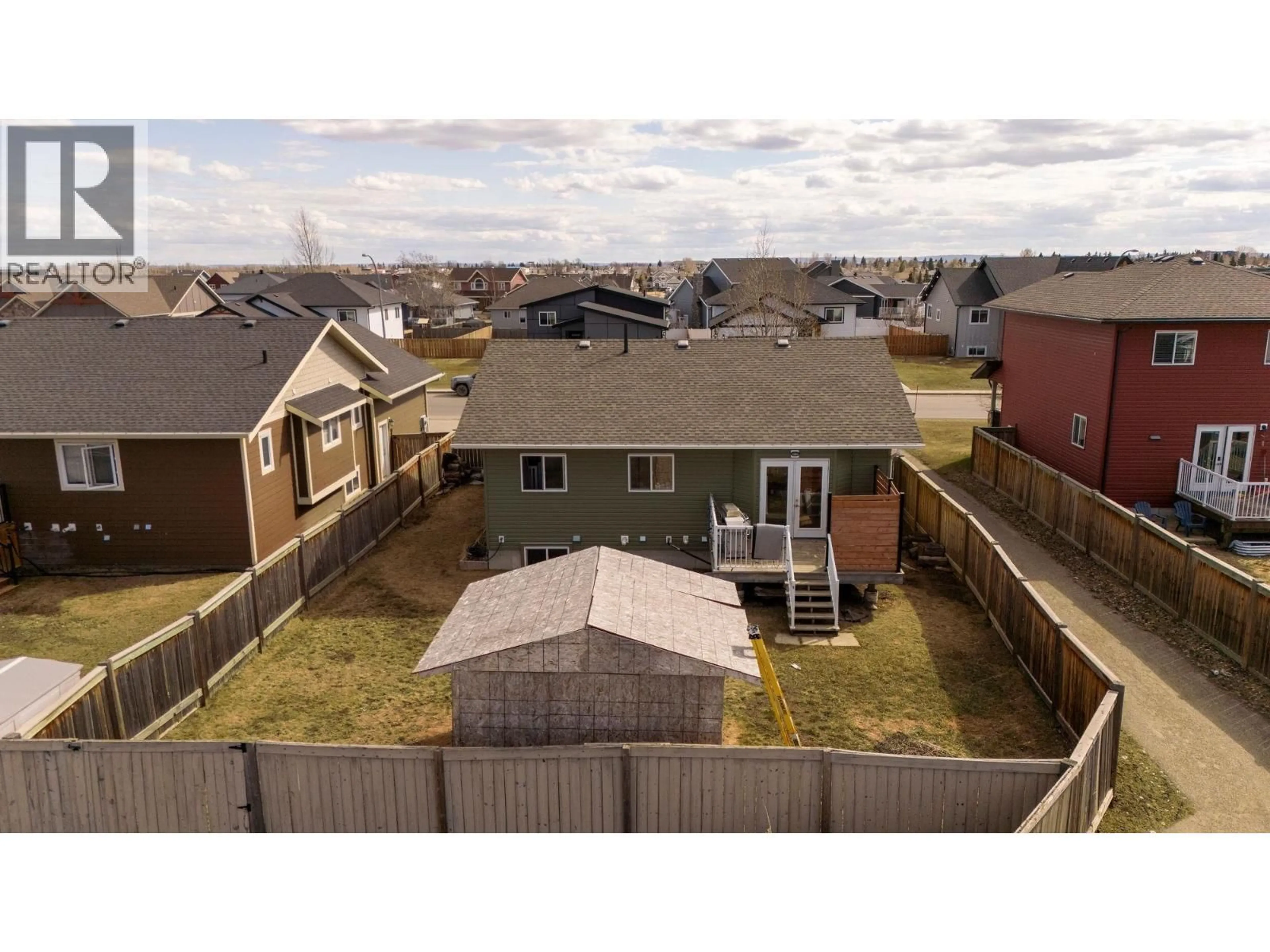 A pic from outside/outdoor area/front of a property/back of a property/a pic from drone, unknown for 8908 112 AVENUE, Fort St. John British Columbia V1J0J1