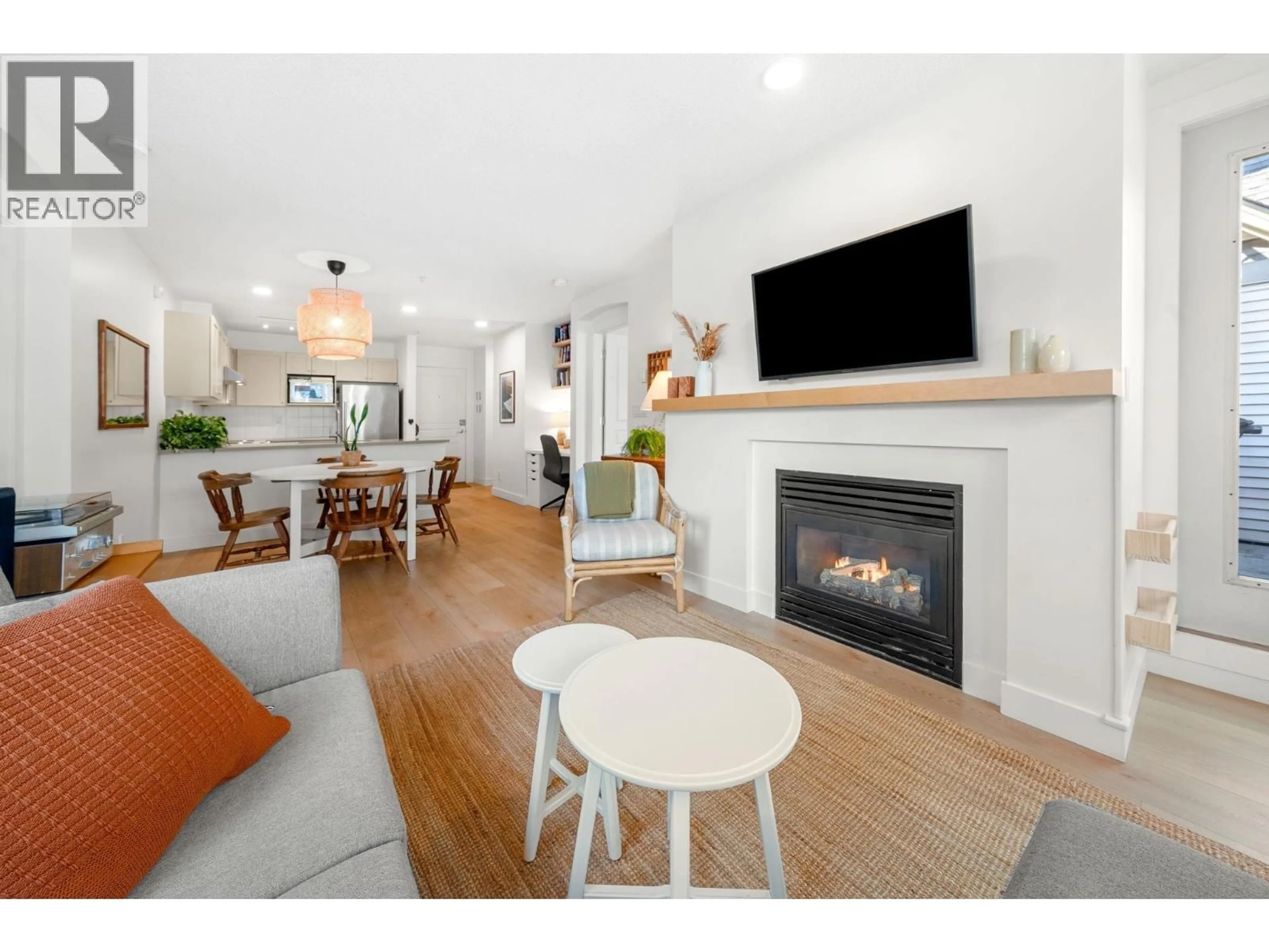 Living room with furniture, wood/laminate floor for 301 - 333 1ST STREET, North Vancouver British Columbia V7L4W9