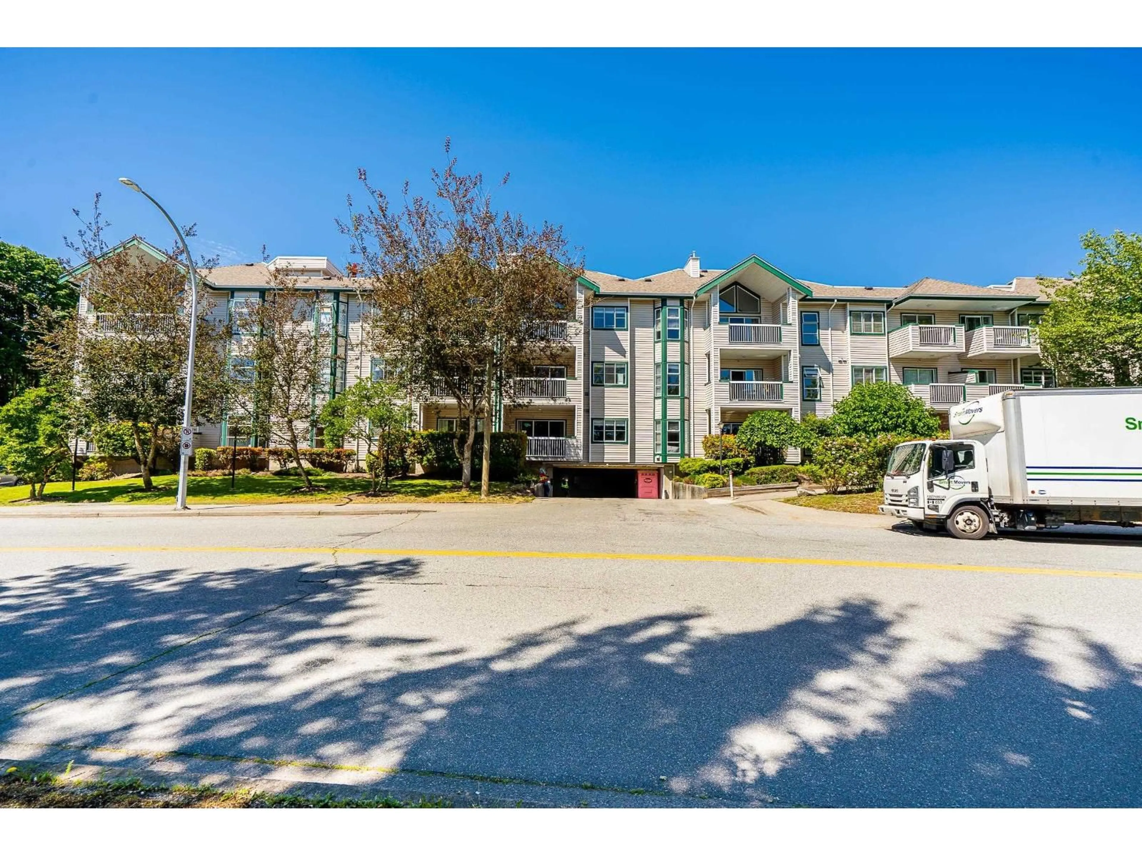 A pic from outside/outdoor area/front of a property/back of a property/a pic from drone, street for 202 - 13911 70 AVENUE, Surrey British Columbia V3W6B4