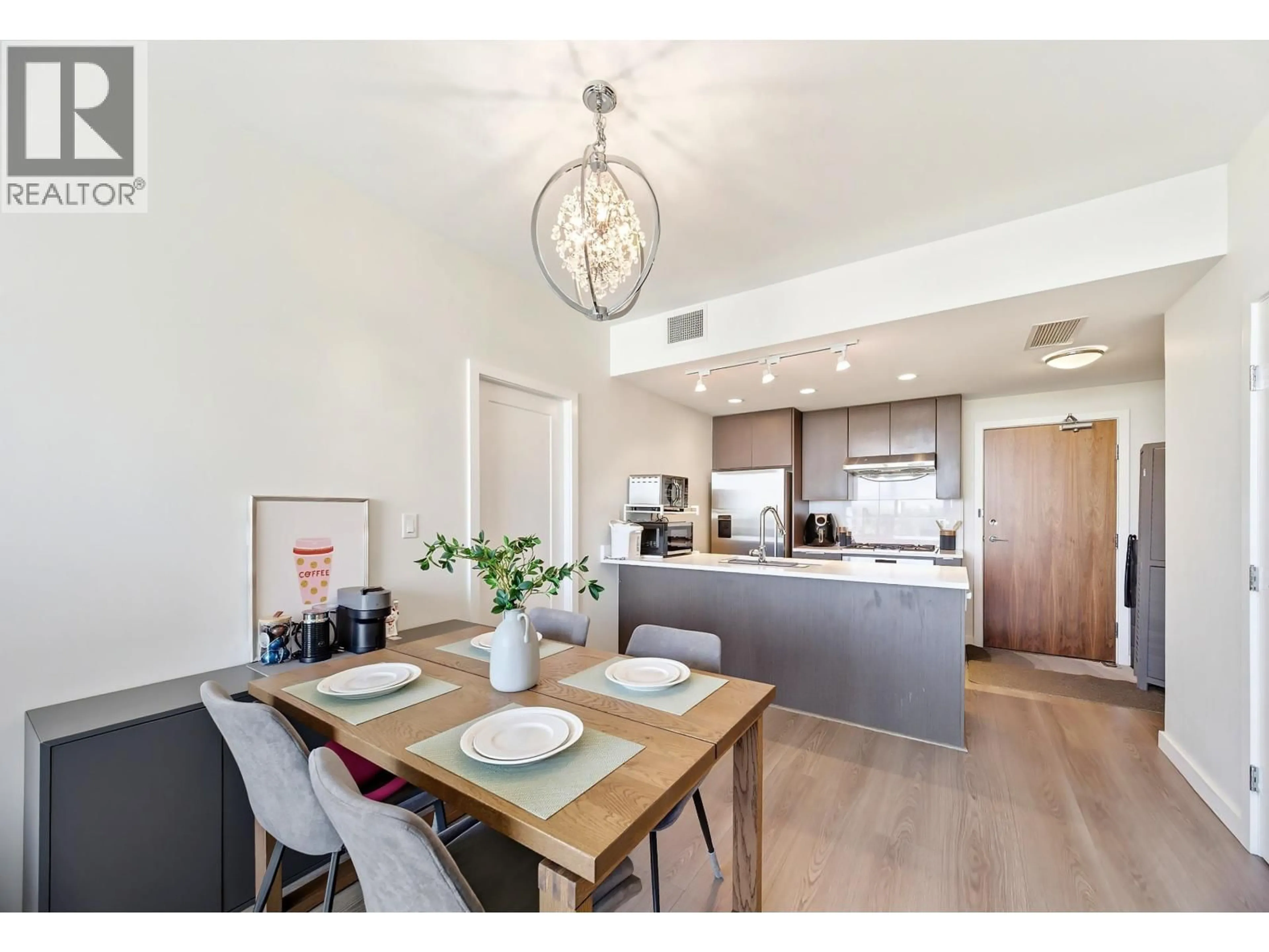 Open concept kitchen, wood/laminate floor for 911 - 3333 SEXSMITH ROAD, Richmond British Columbia V6X0R7