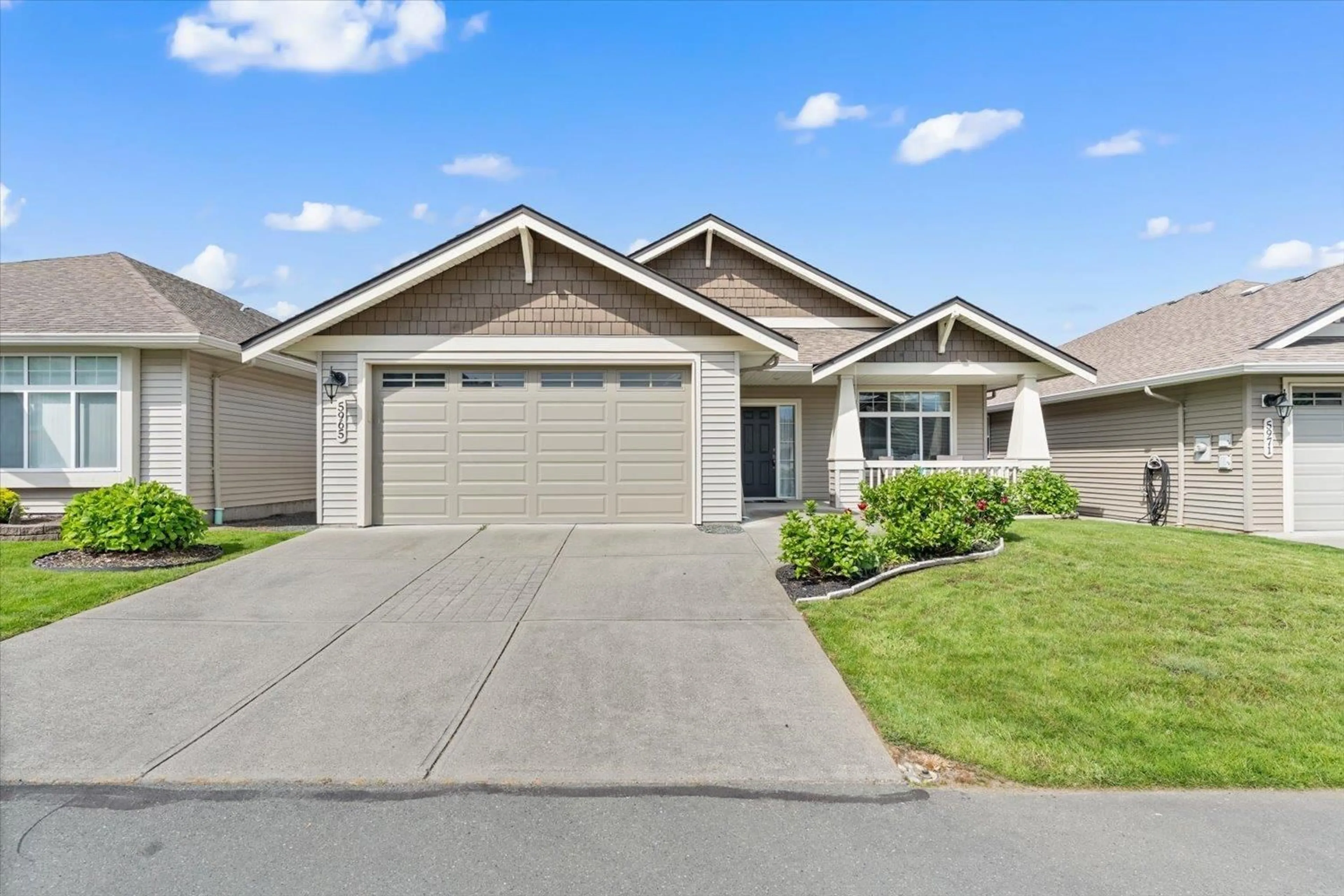 Home with vinyl exterior material, street for 5965 RIVERSTONE STREET, Chilliwack British Columbia V2R0E2