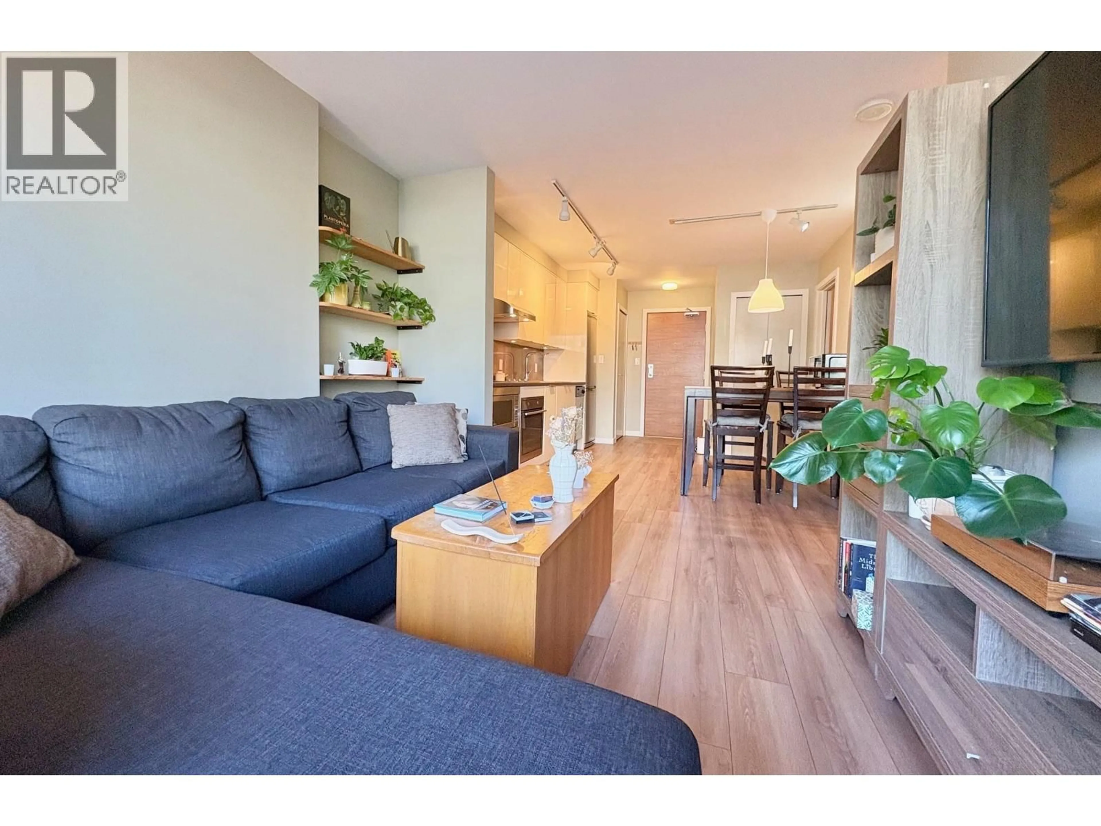 Living room with furniture, wood/laminate floor for 308 - 161 GEORGIA STREET, Vancouver British Columbia V6B0K9
