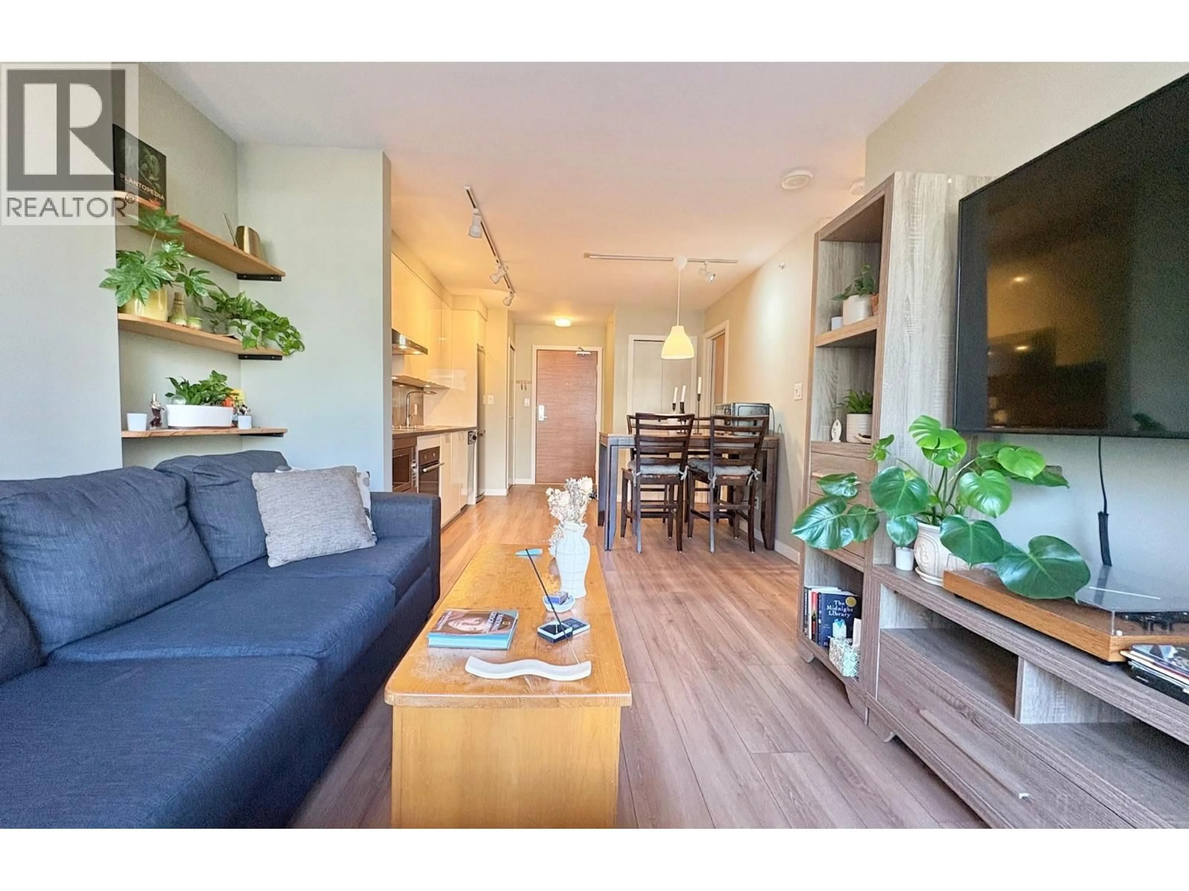 Living room with furniture, wood/laminate floor for 308 - 161 GEORGIA STREET, Vancouver British Columbia V6B0K9