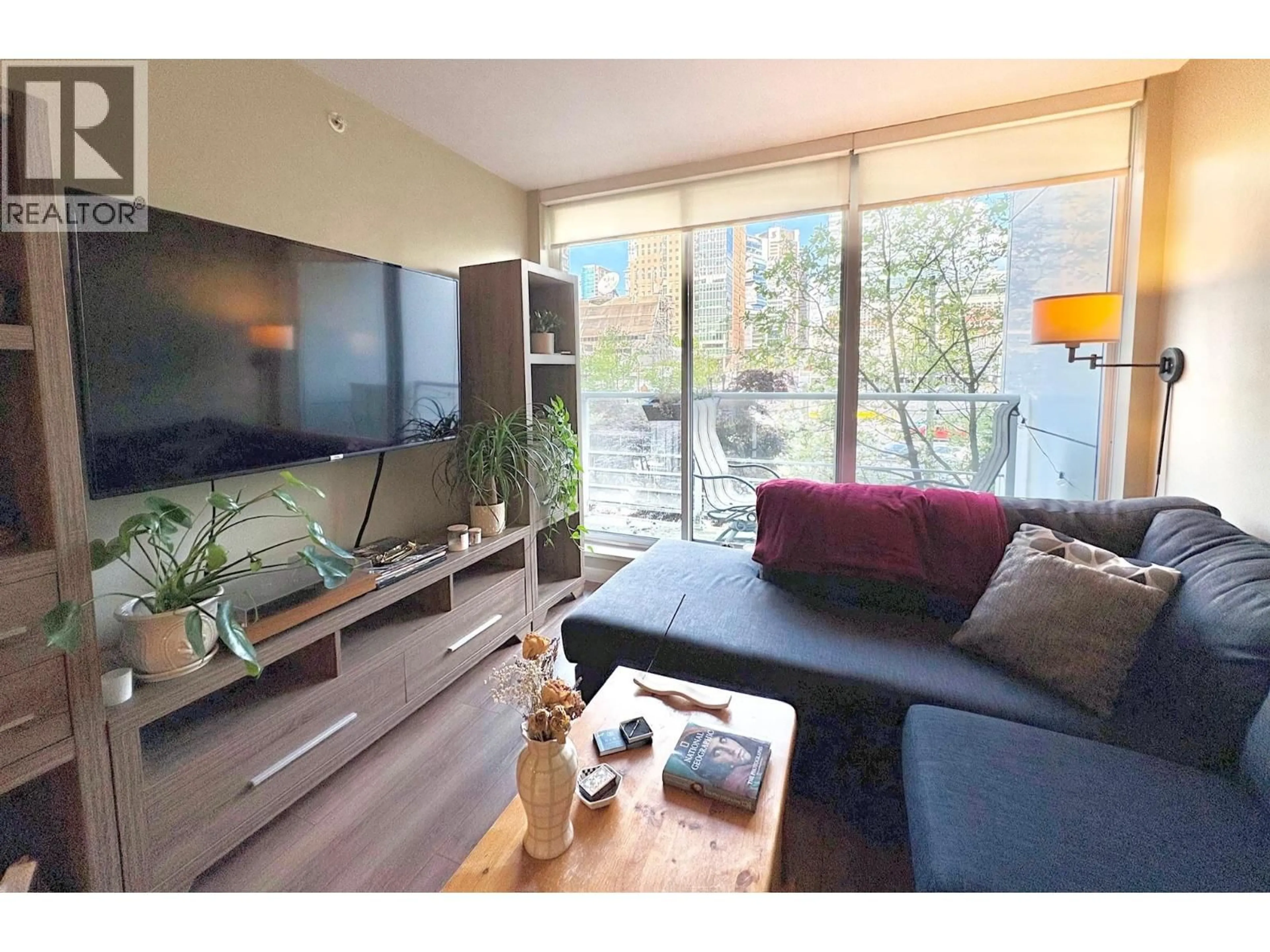 Living room with furniture, wood/laminate floor for 308 - 161 GEORGIA STREET, Vancouver British Columbia V6B0K9