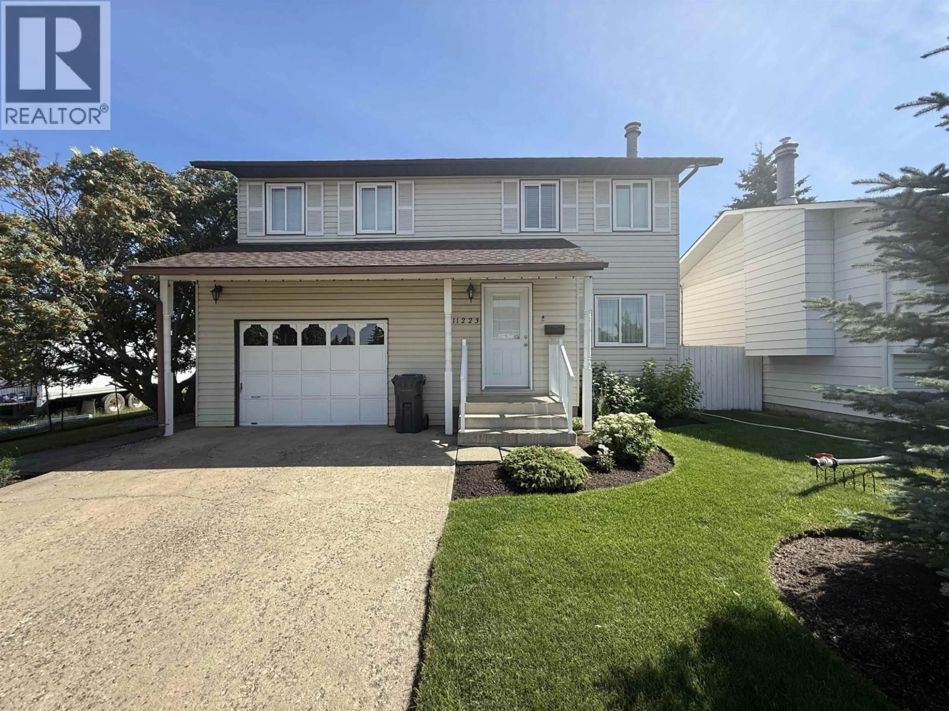 Home with vinyl exterior material, street for 11223 102 STREET, Fort St. John British Columbia V1J4T2