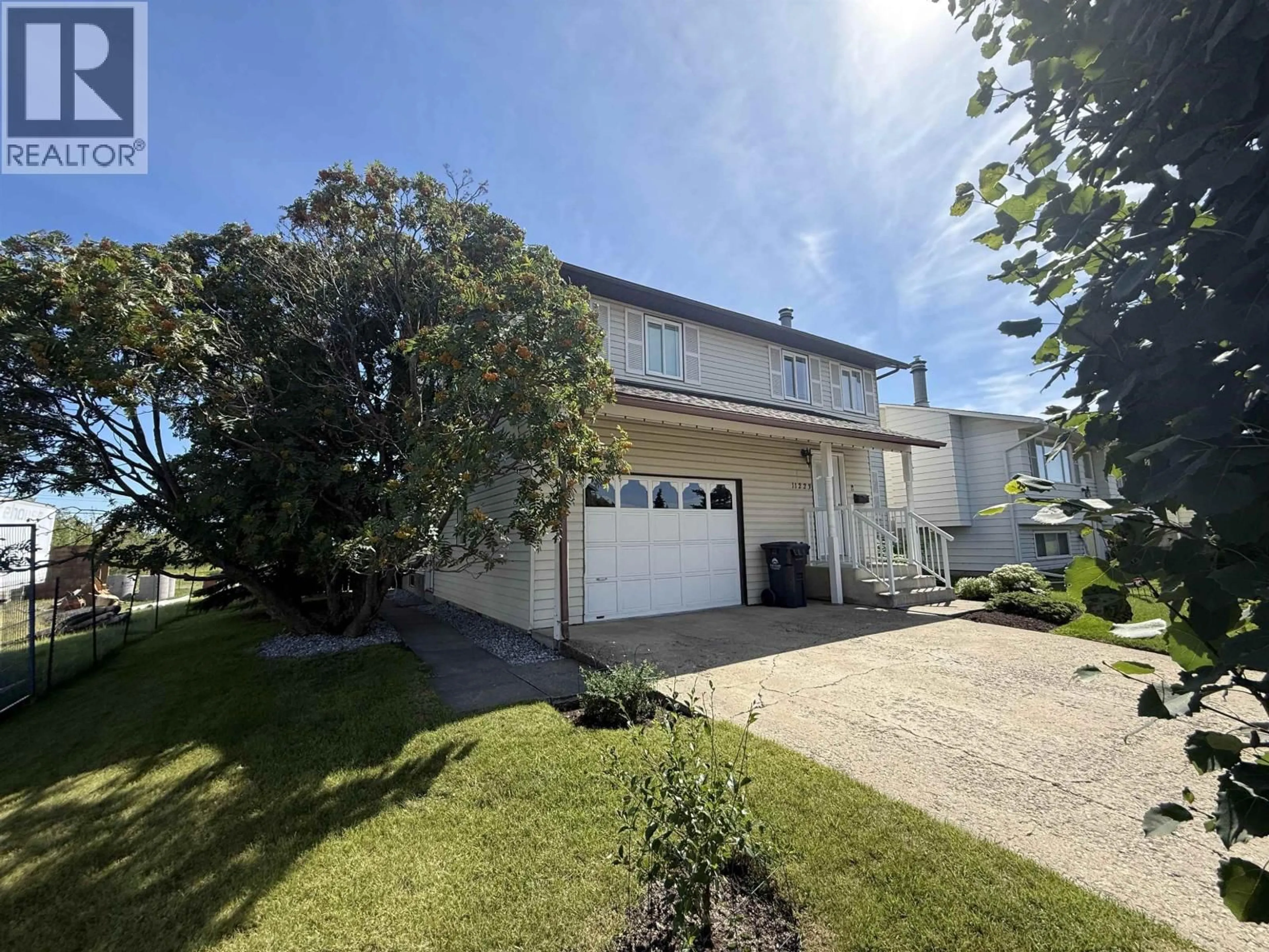 A pic from outside/outdoor area/front of a property/back of a property/a pic from drone, street for 11223 102 STREET, Fort St. John British Columbia V1J4T2