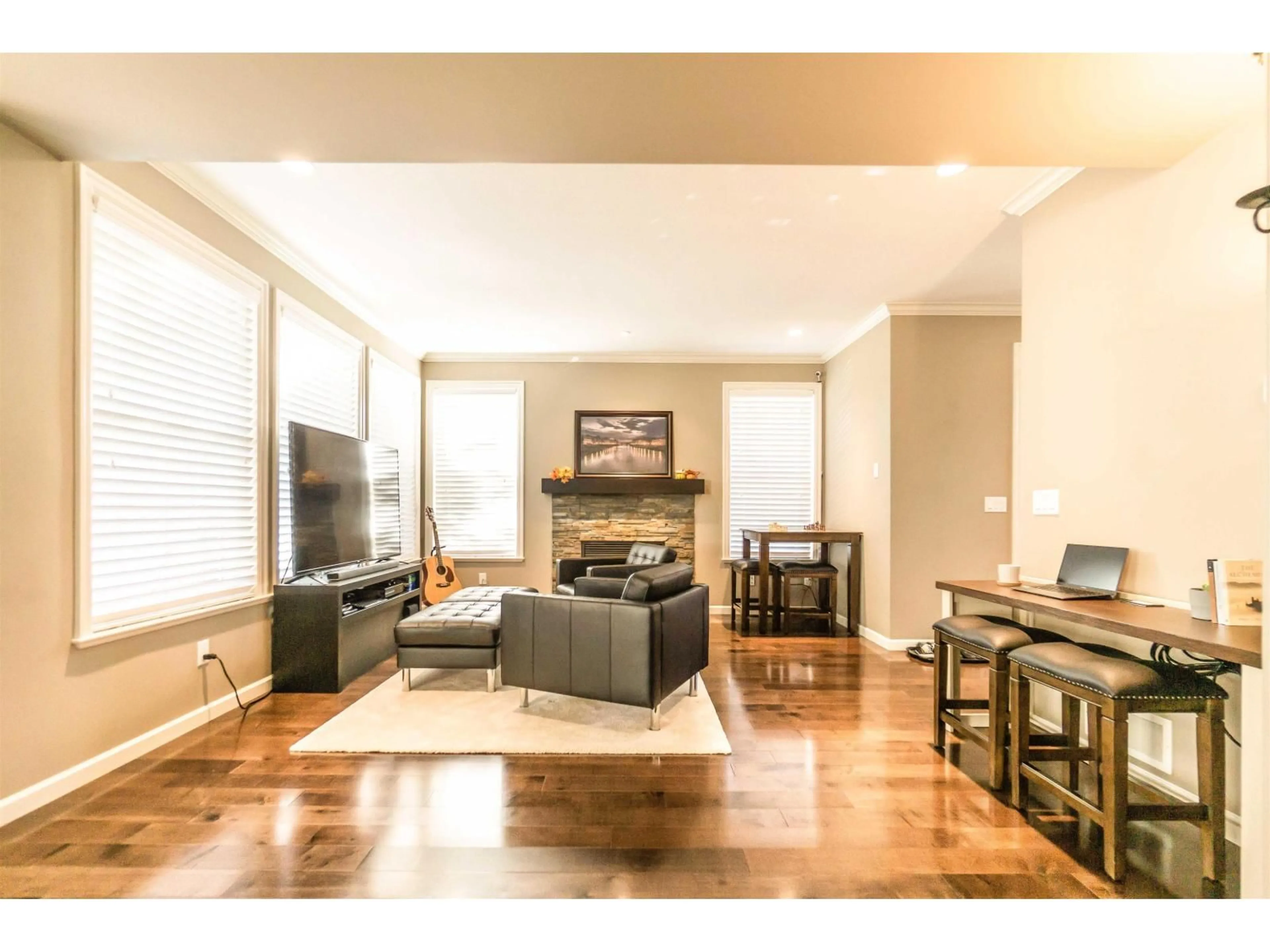 Living room with furniture, wood/laminate floor for 7158 208A STREET, Langley British Columbia V2Y0J1