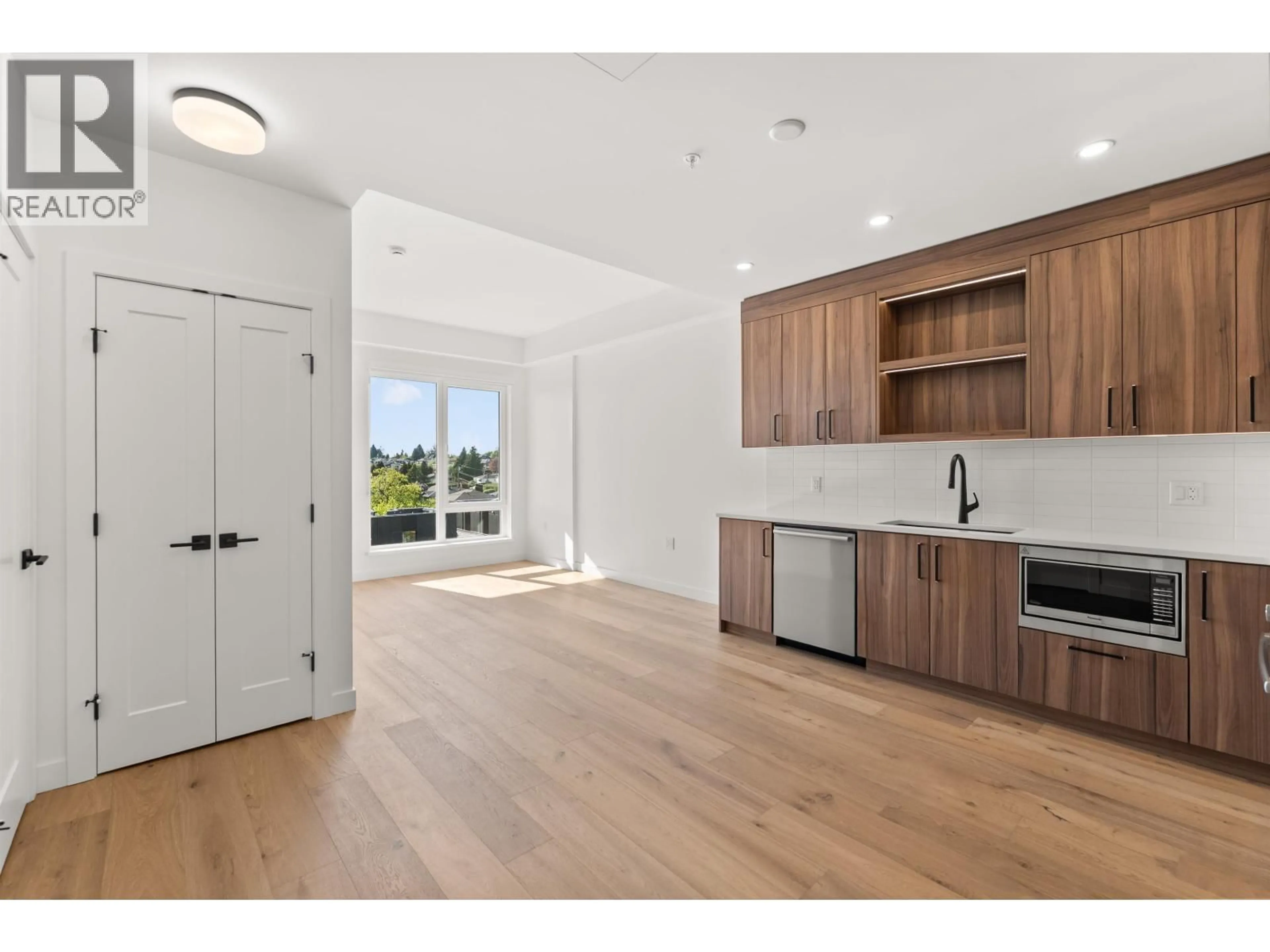 Open concept kitchen, wood/laminate floor for 602 - 6859 CAMBIE STREET, Vancouver British Columbia V6P3H1