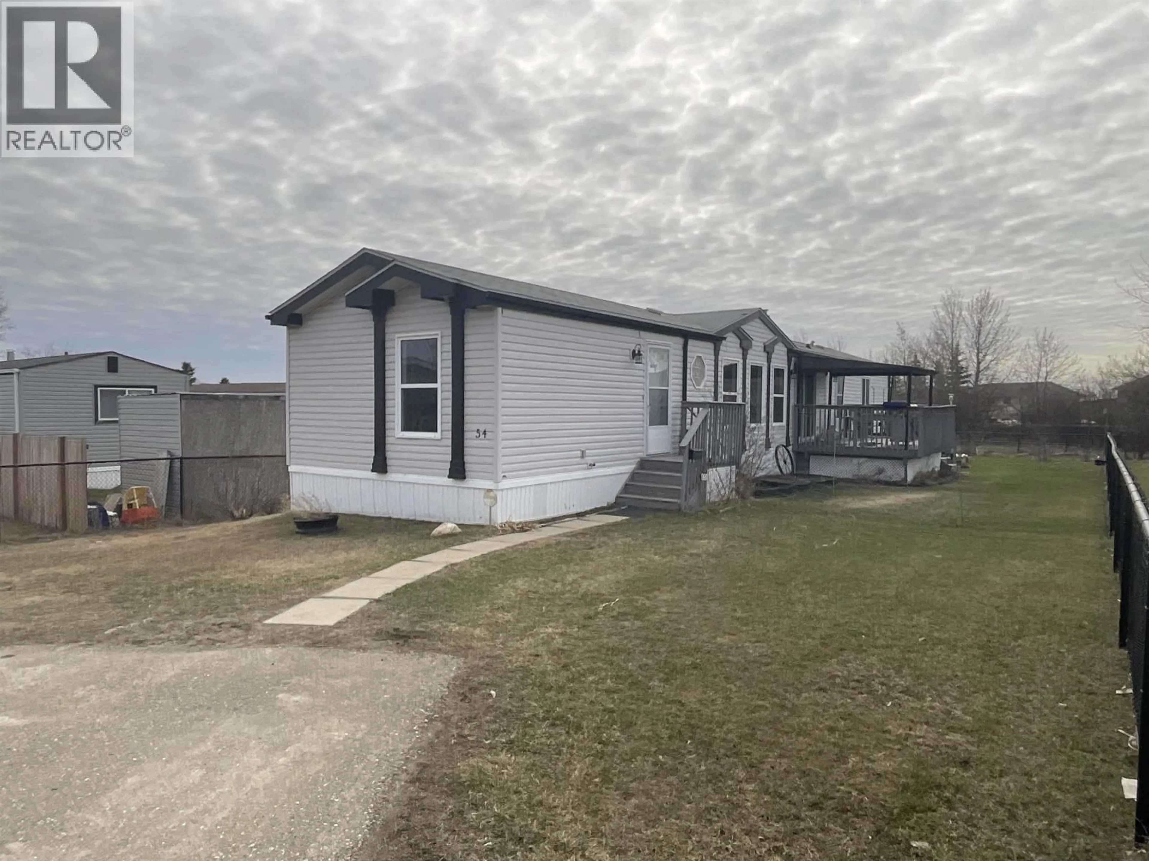 A pic from outside/outdoor area/front of a property/back of a property/a pic from drone, street for 54 - 9203 82 STREET, Fort St. John British Columbia V2J5G5