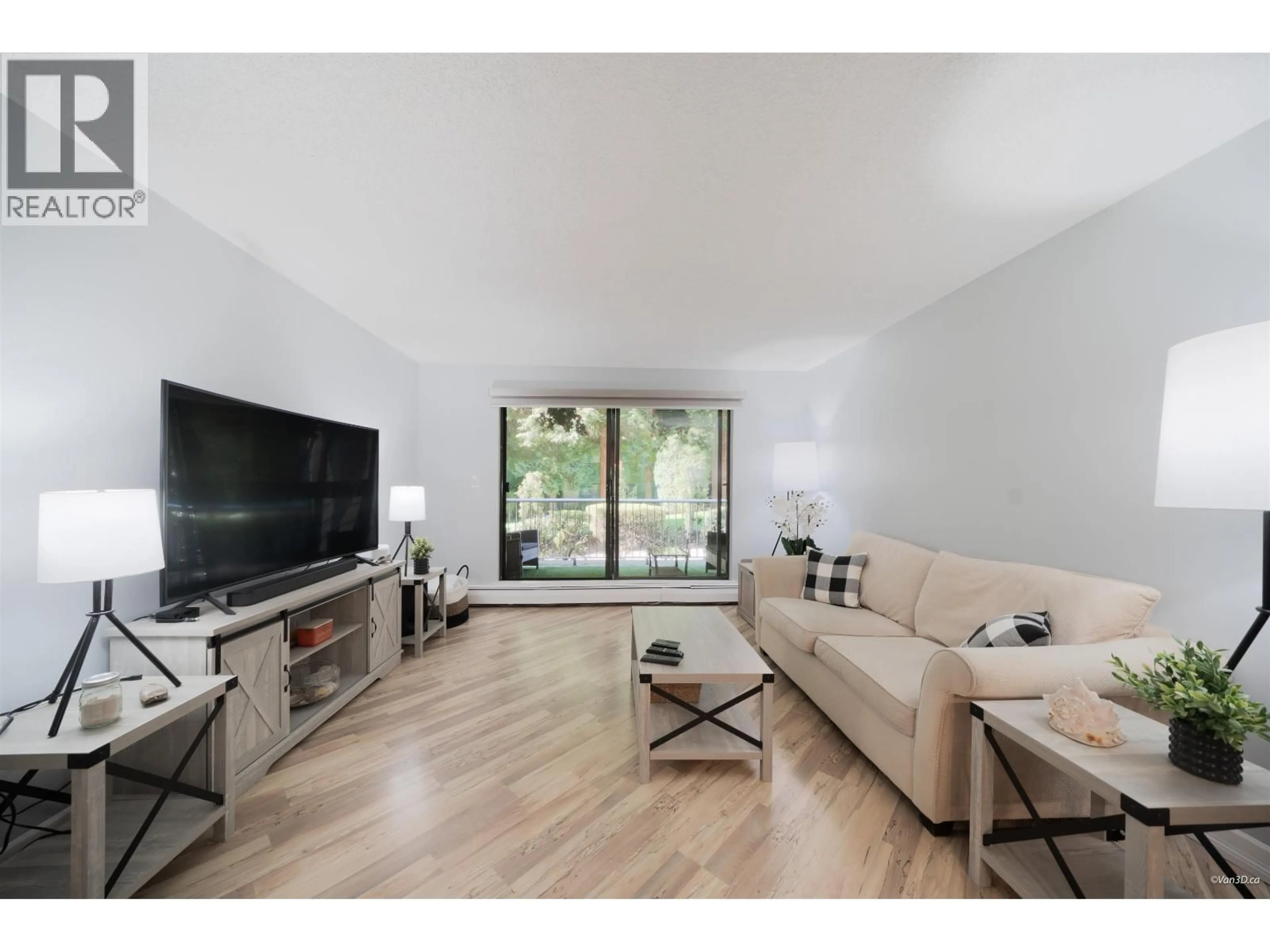 Living room with furniture, wood/laminate floor for 107 - 3911 CARRIGAN CRESCENT, Burnaby British Columbia V3N4J7