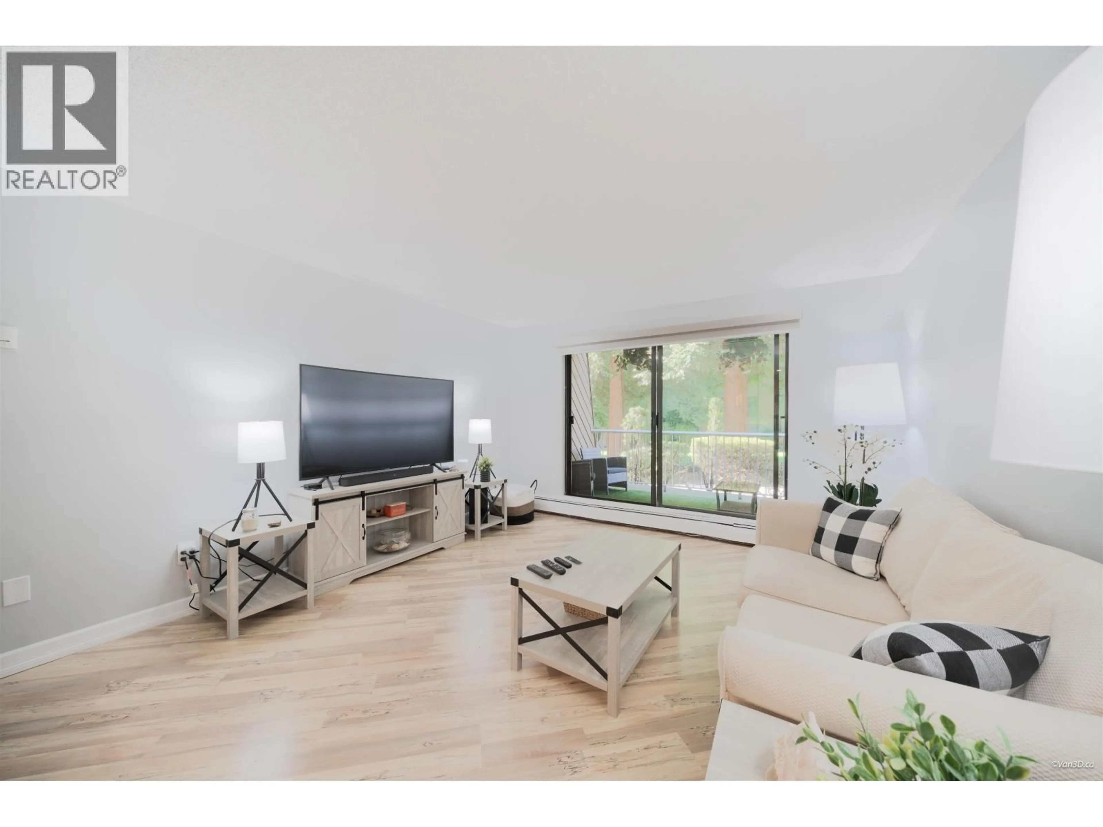Living room with furniture, wood/laminate floor for 107 - 3911 CARRIGAN CRESCENT, Burnaby British Columbia V3N4J7