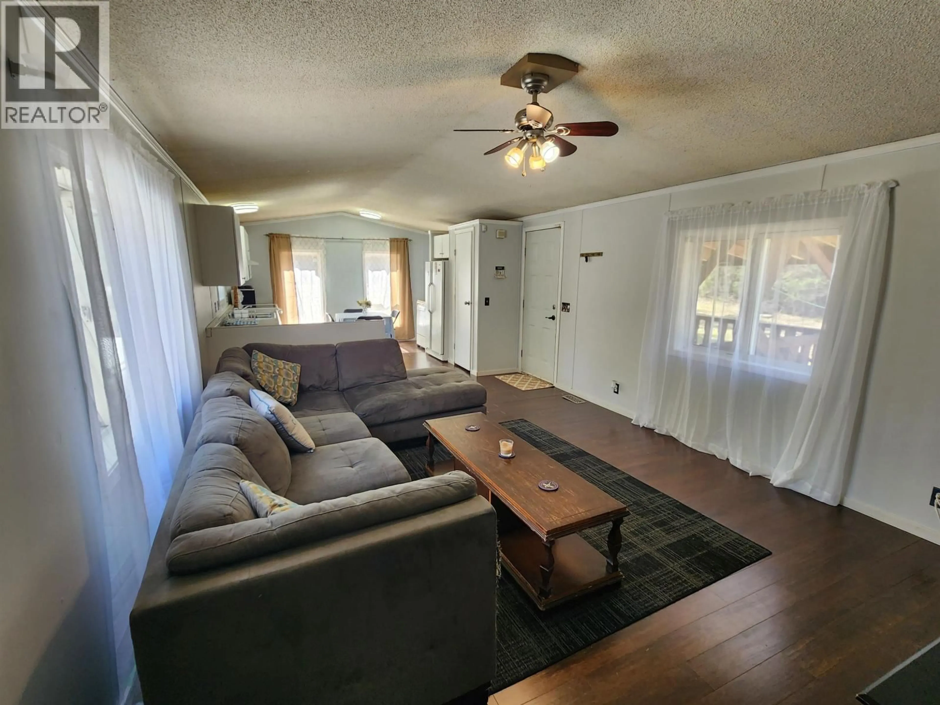 Living room with furniture, wood/laminate floor for 16110 WRIGHT CREEK ROAD, Prince George British Columbia V2K5T2