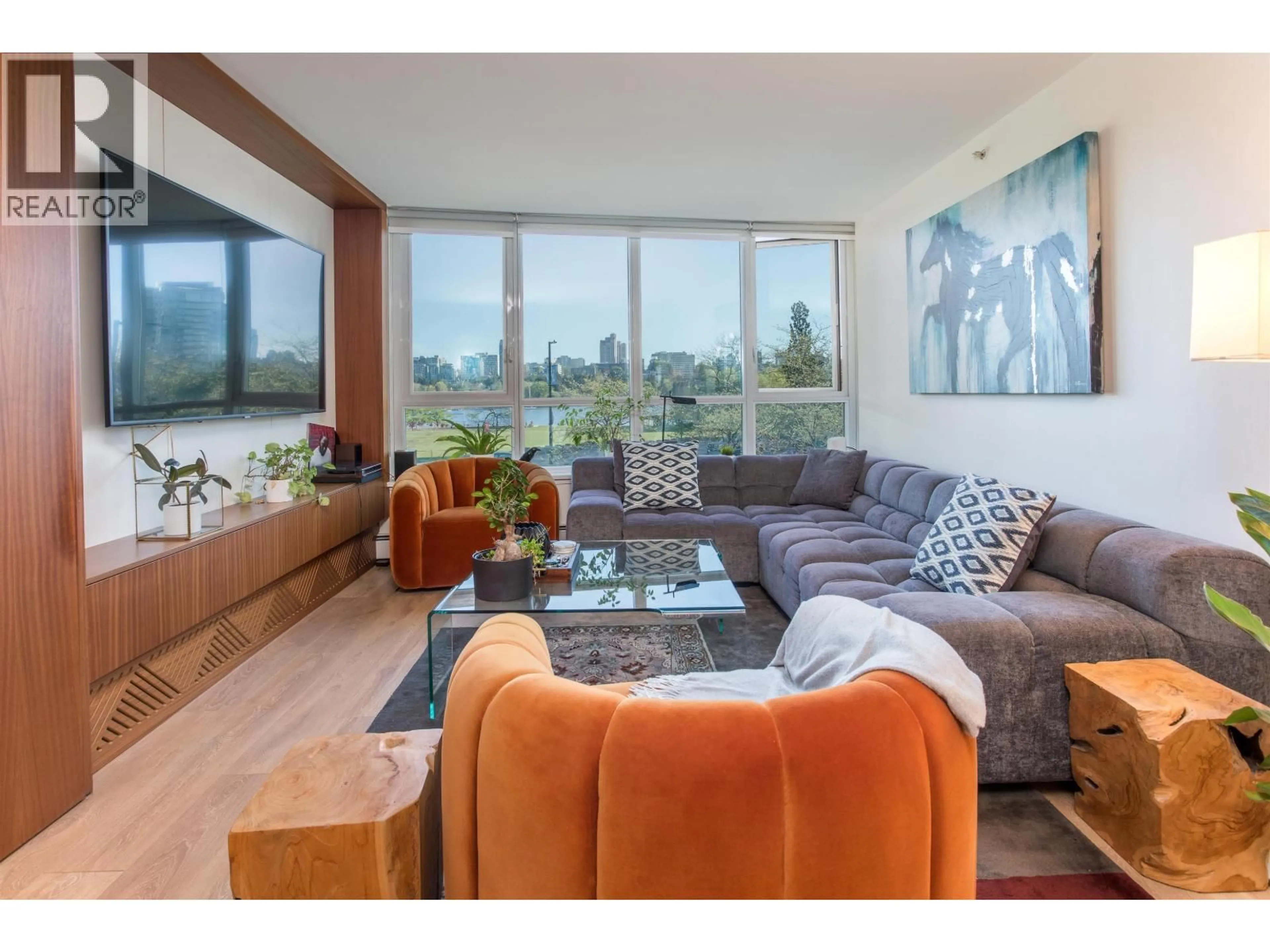 Living room with furniture, wood/laminate floor for 203 - 388 DRAKE STREET, Vancouver British Columbia V6B6A8