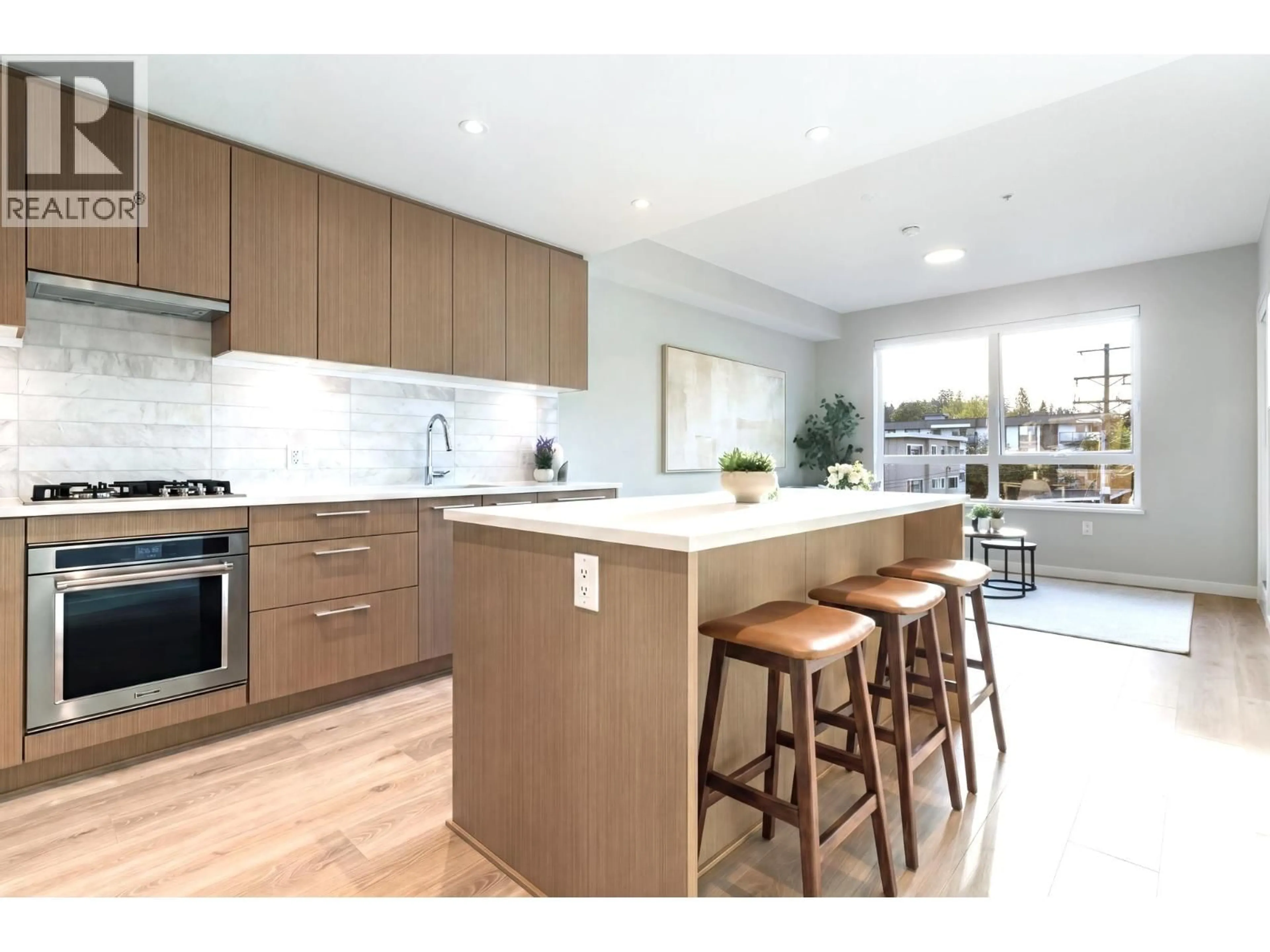 Open concept kitchen, wood/laminate floor for 312 - 110 17TH STREET, North Vancouver British Columbia V7L2V5