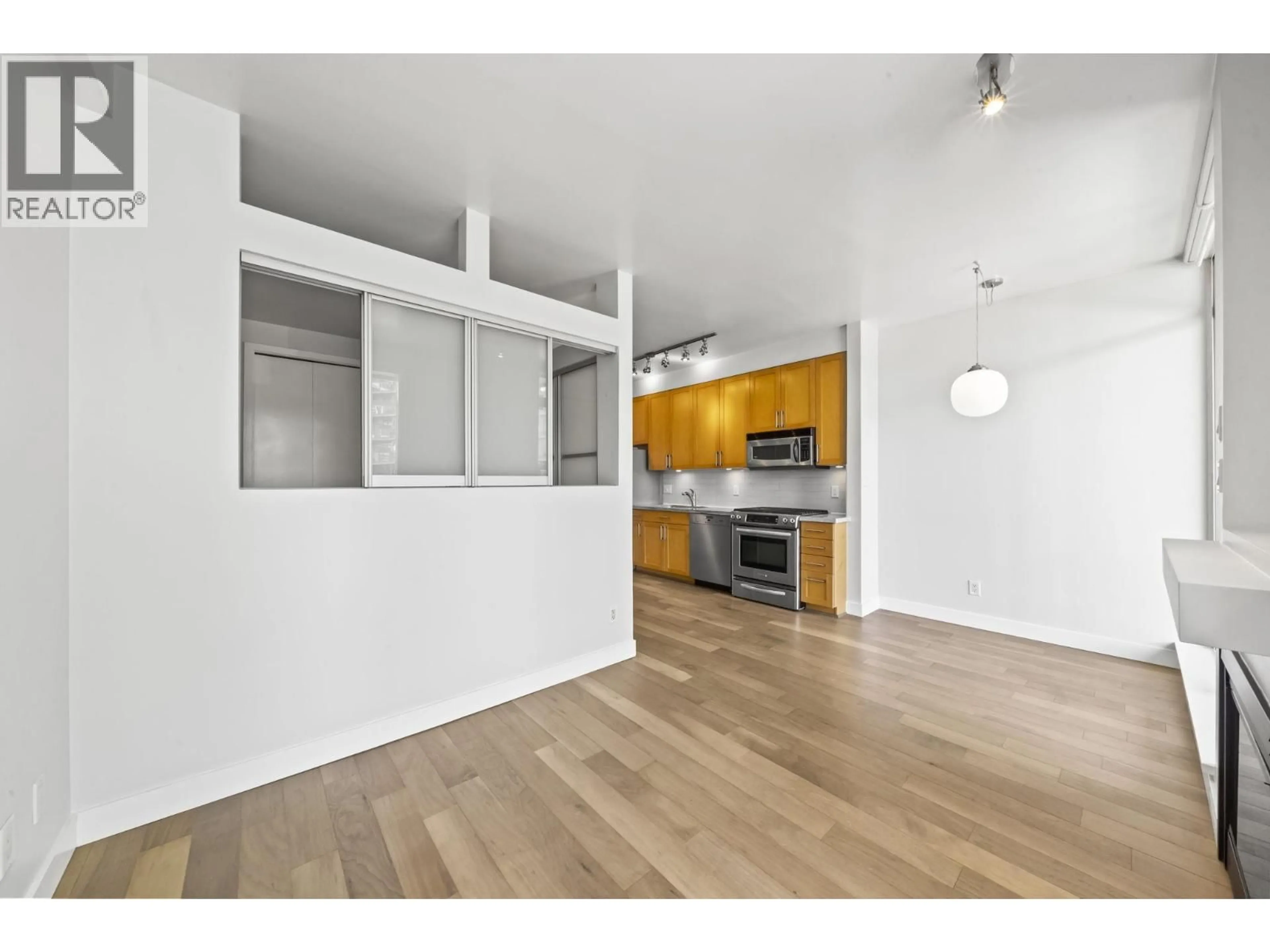 Open concept kitchen, wood/laminate floor for 304 - 2055 YUKON STREET, Vancouver British Columbia V5Y4B7