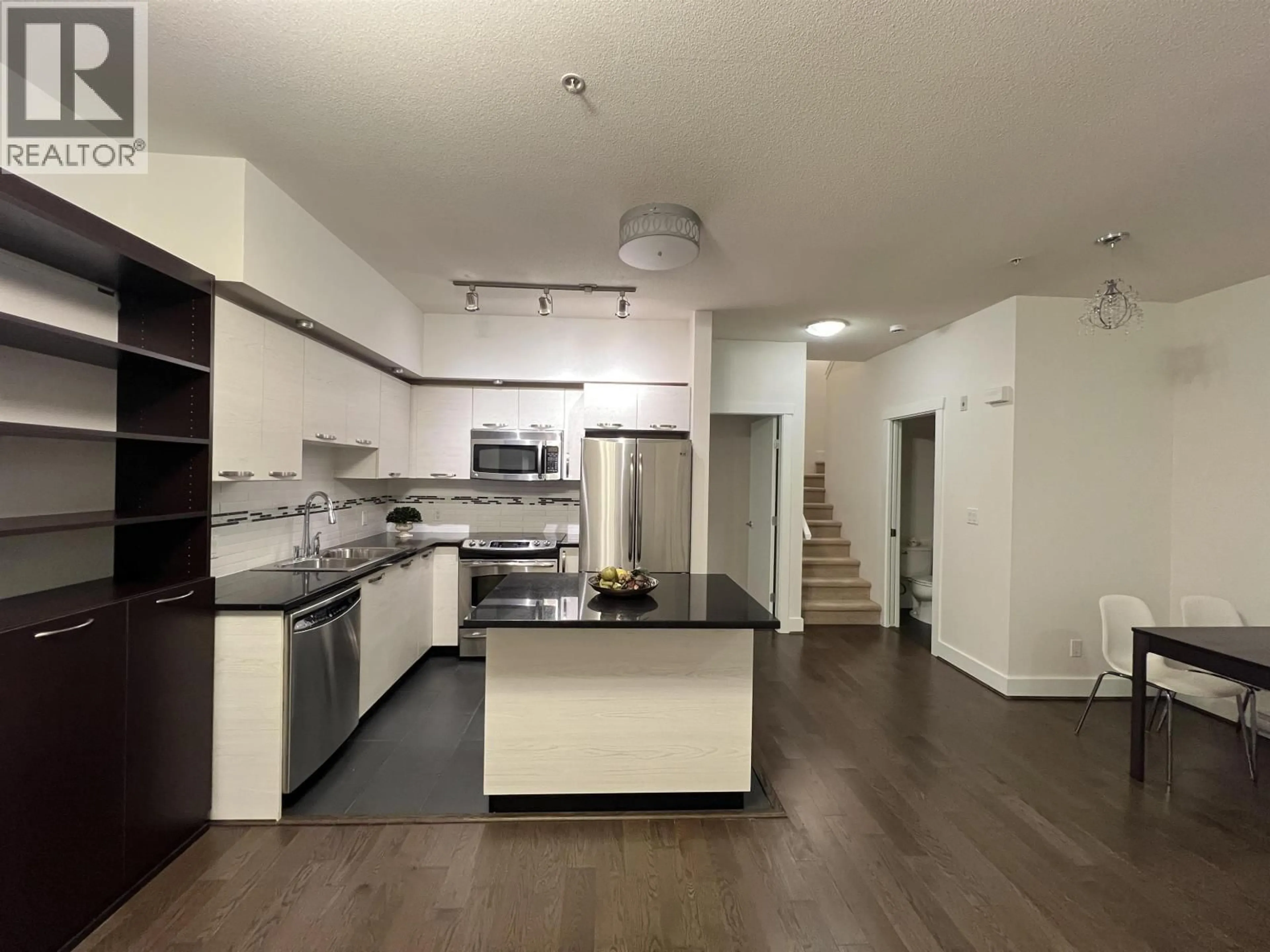 Open concept kitchen, unknown for 103 - 7478 BYRNEPARK WALK, Burnaby British Columbia V3N0B5