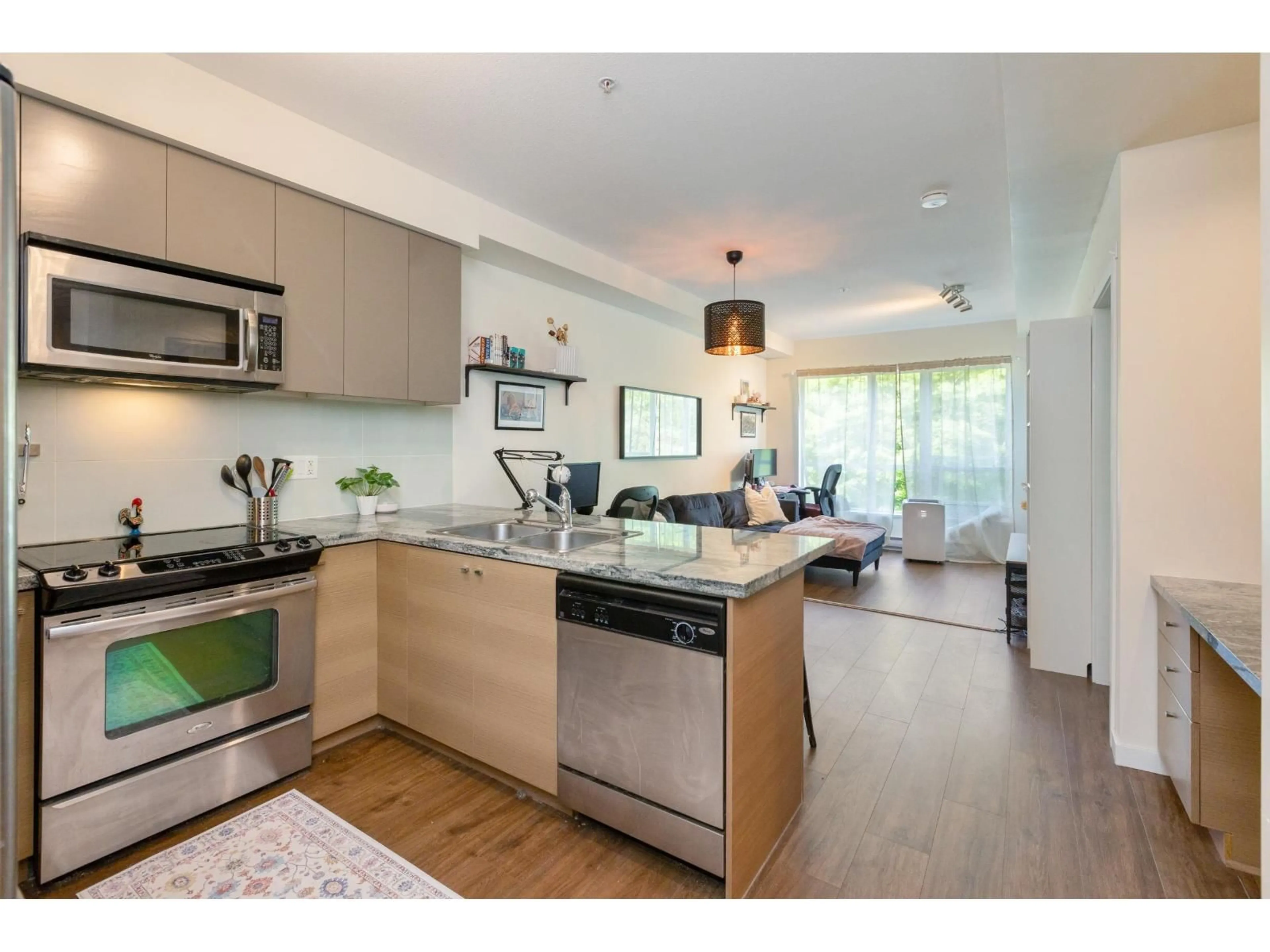 Open concept kitchen, wood/laminate floor for 311 - 6420 194 STREET, Surrey British Columbia V4N6J7