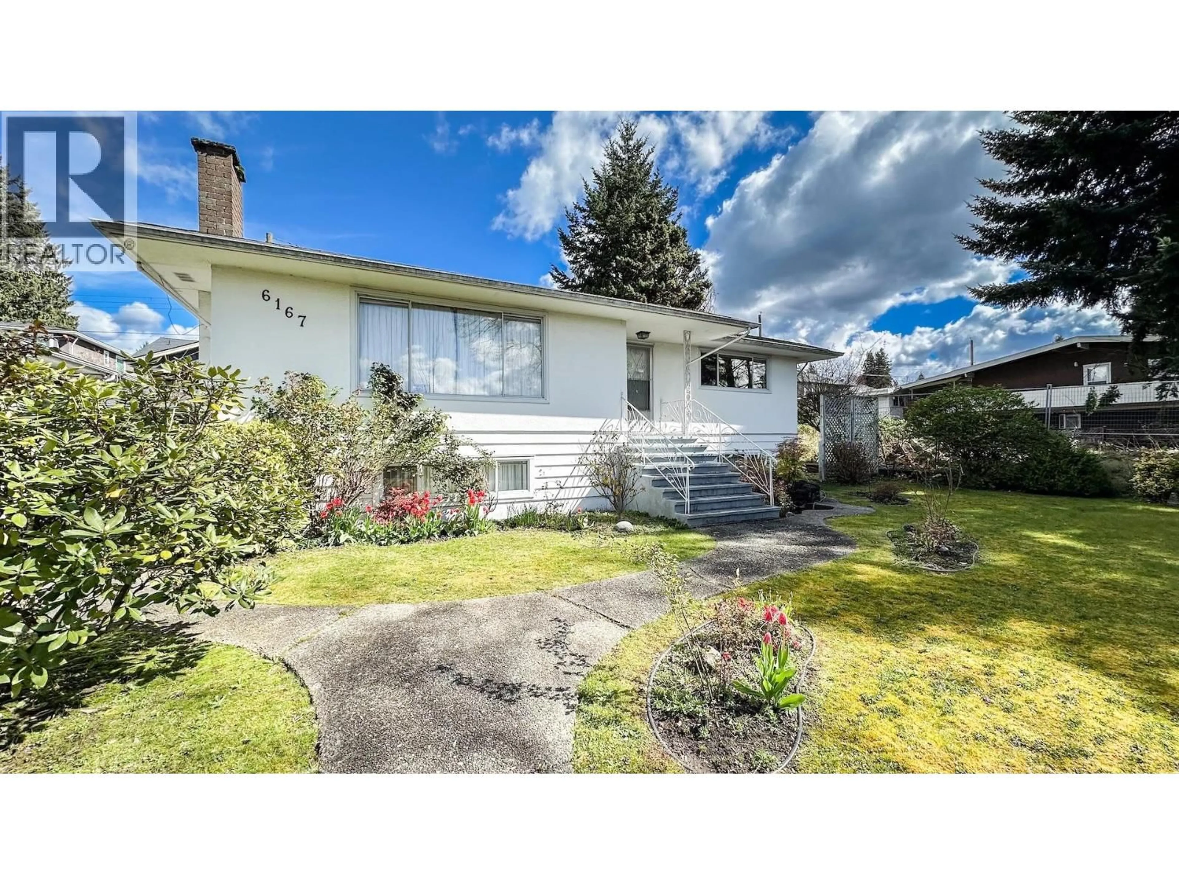 Home with vinyl exterior material, street for 6167 BROADWAY, Burnaby British Columbia V5B2Y3