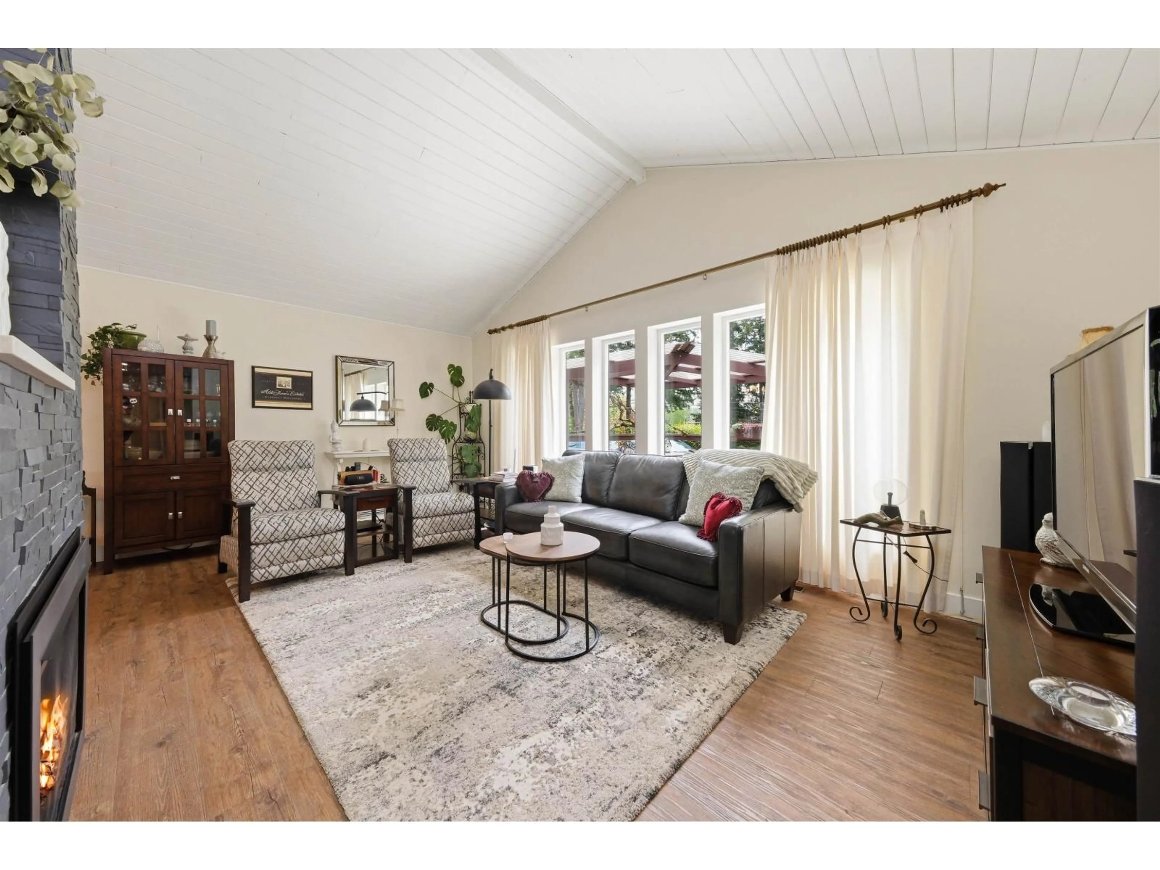 Living room with furniture, wood/laminate floor for 23541 24 AVENUE, Langley British Columbia V2Z3A2