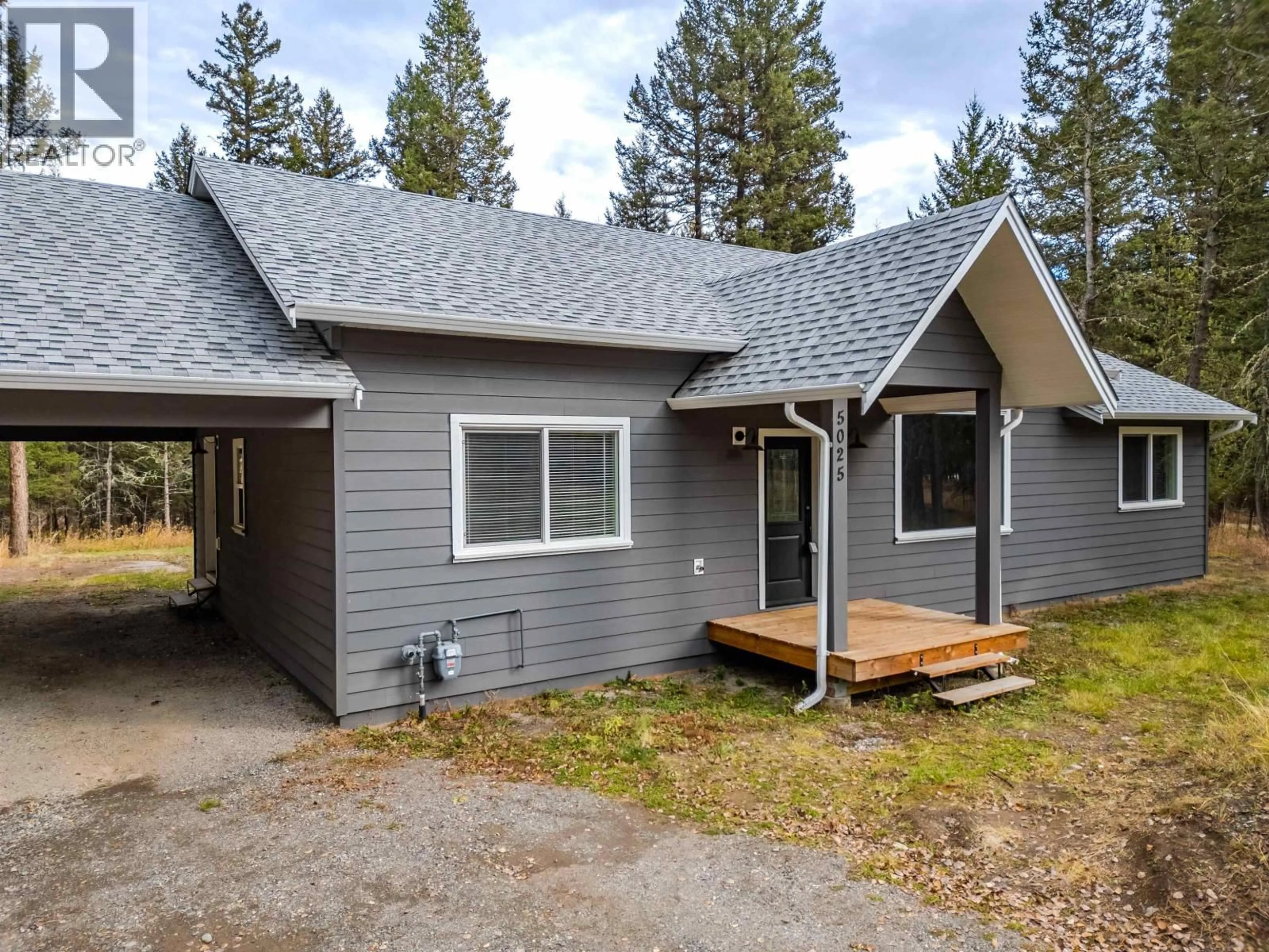 Home with vinyl exterior material, street for 5025 KYLLO ROAD, 108 Mile Ranch British Columbia V0K2Z0