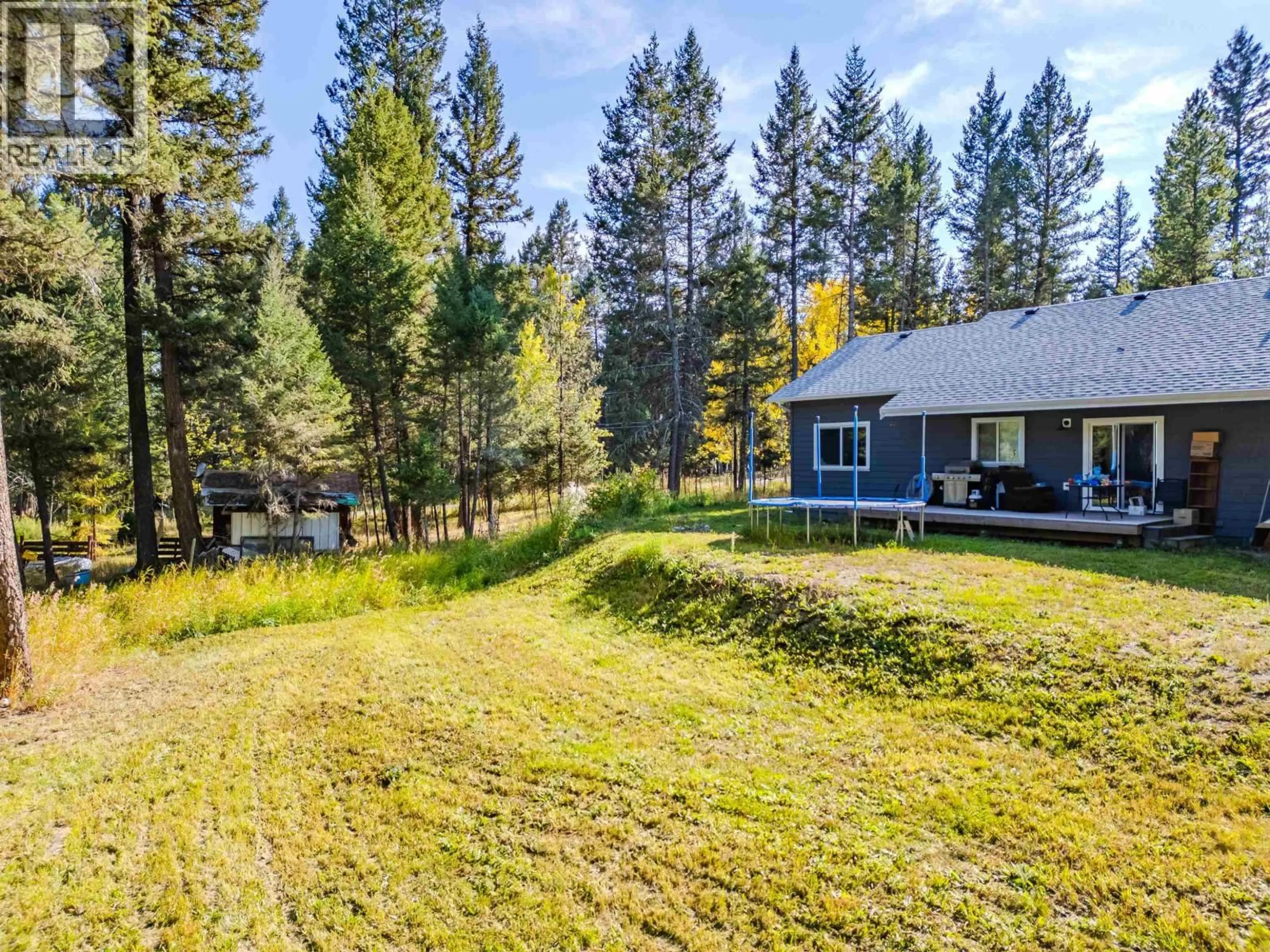 A pic from outside/outdoor area/front of a property/back of a property/a pic from drone, forest/trees view for 5025 KYLLO ROAD, 108 Mile Ranch British Columbia V0K2Z0