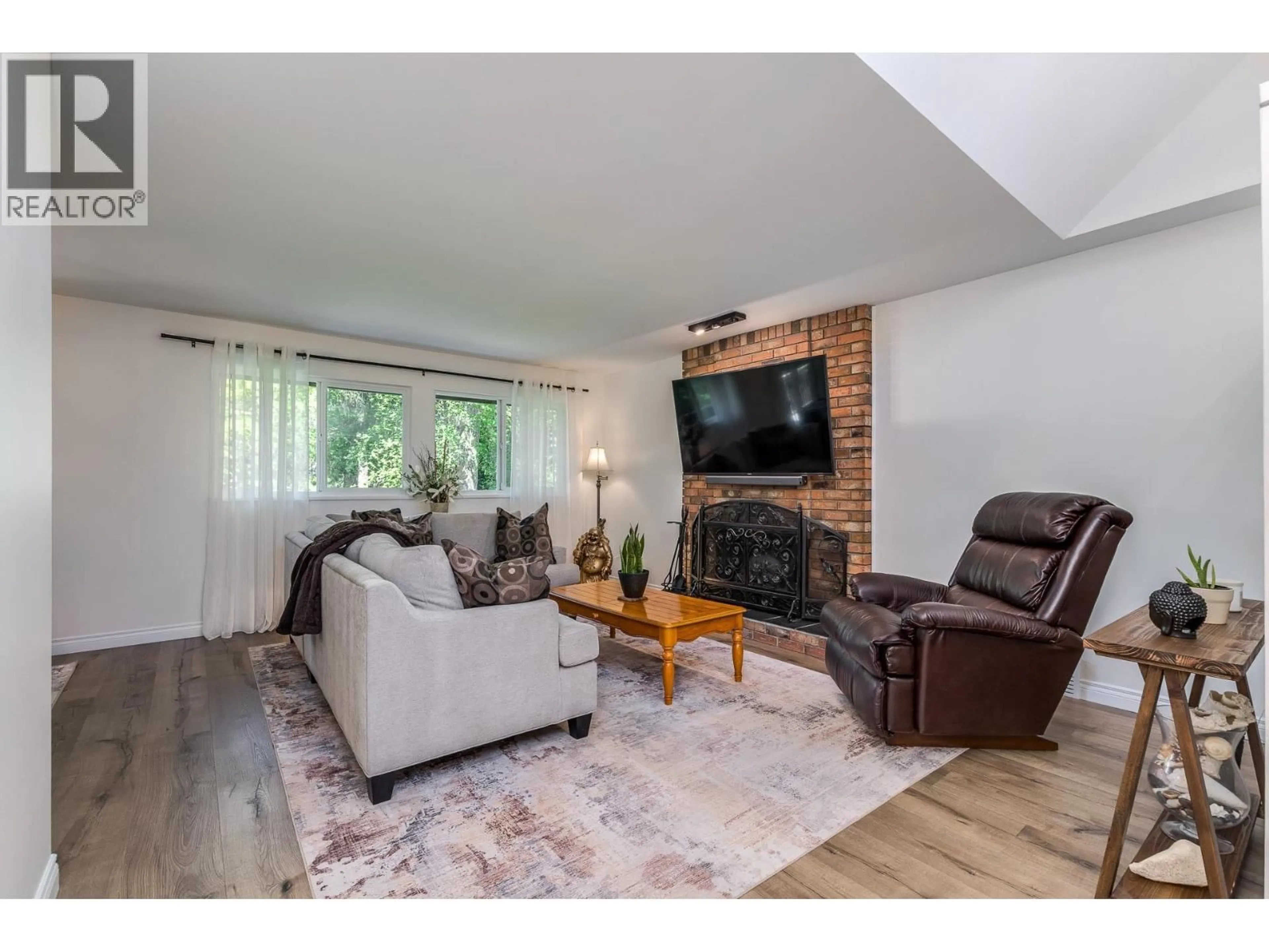 Living room with furniture, wood/laminate floor for 19541 119A AVENUE, Pitt Meadows British Columbia V3Y1K9