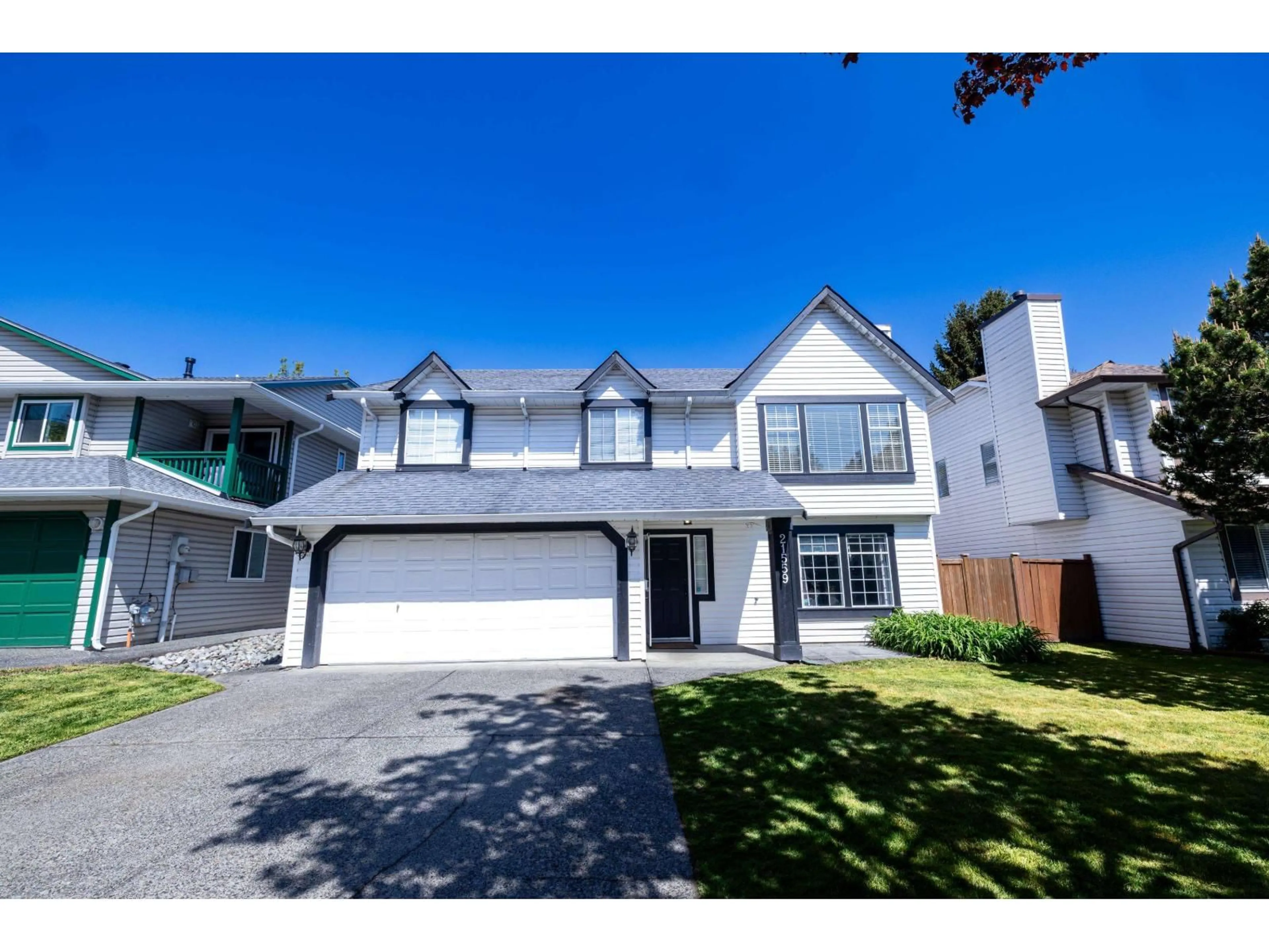 Home with vinyl exterior material, street for 21559 93A AVENUE, Langley British Columbia V1M2H7