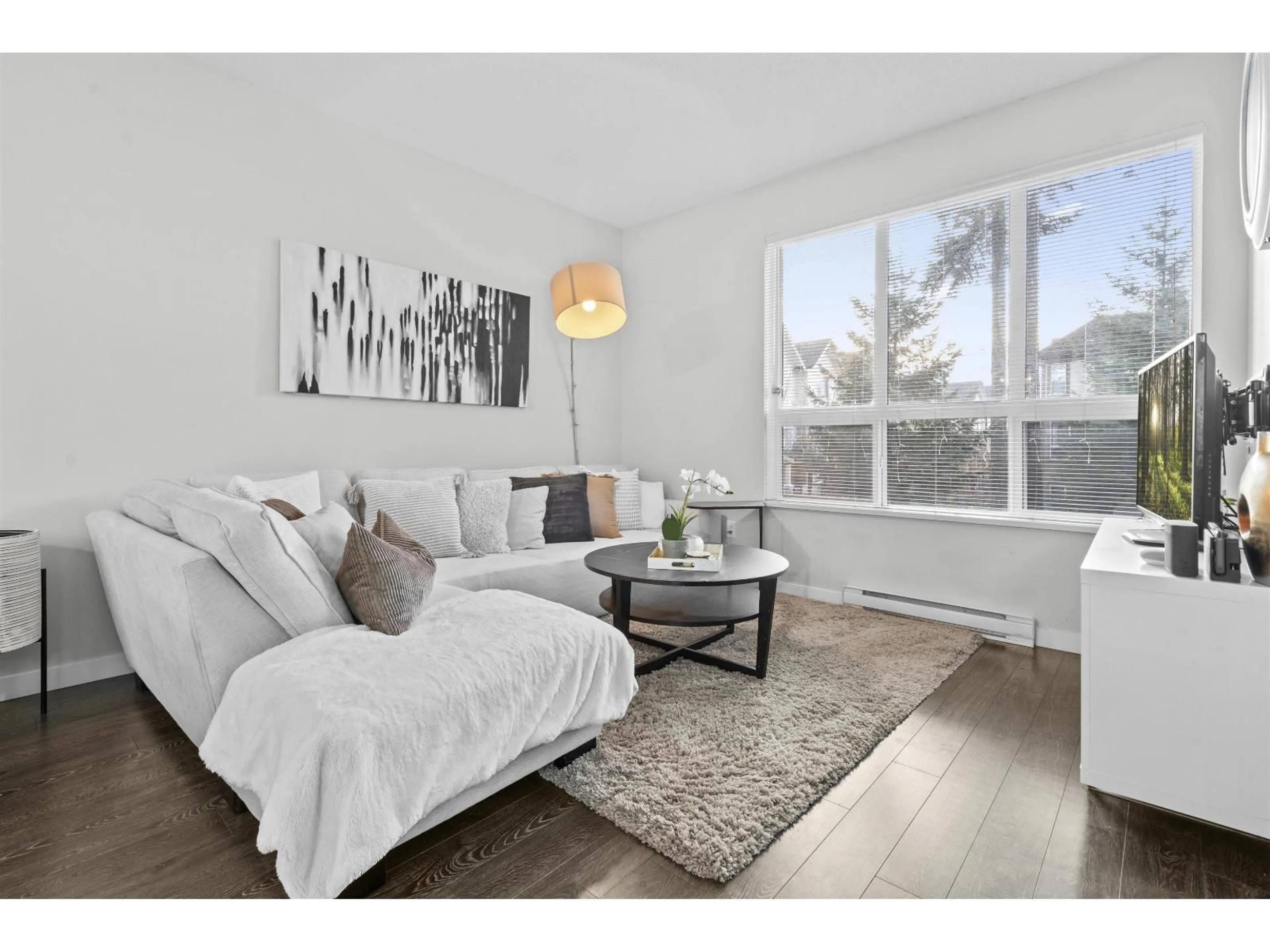 Living room with furniture, wood/laminate floor for 46 - 7848 209 STREET, Langley British Columbia V2Y0M4