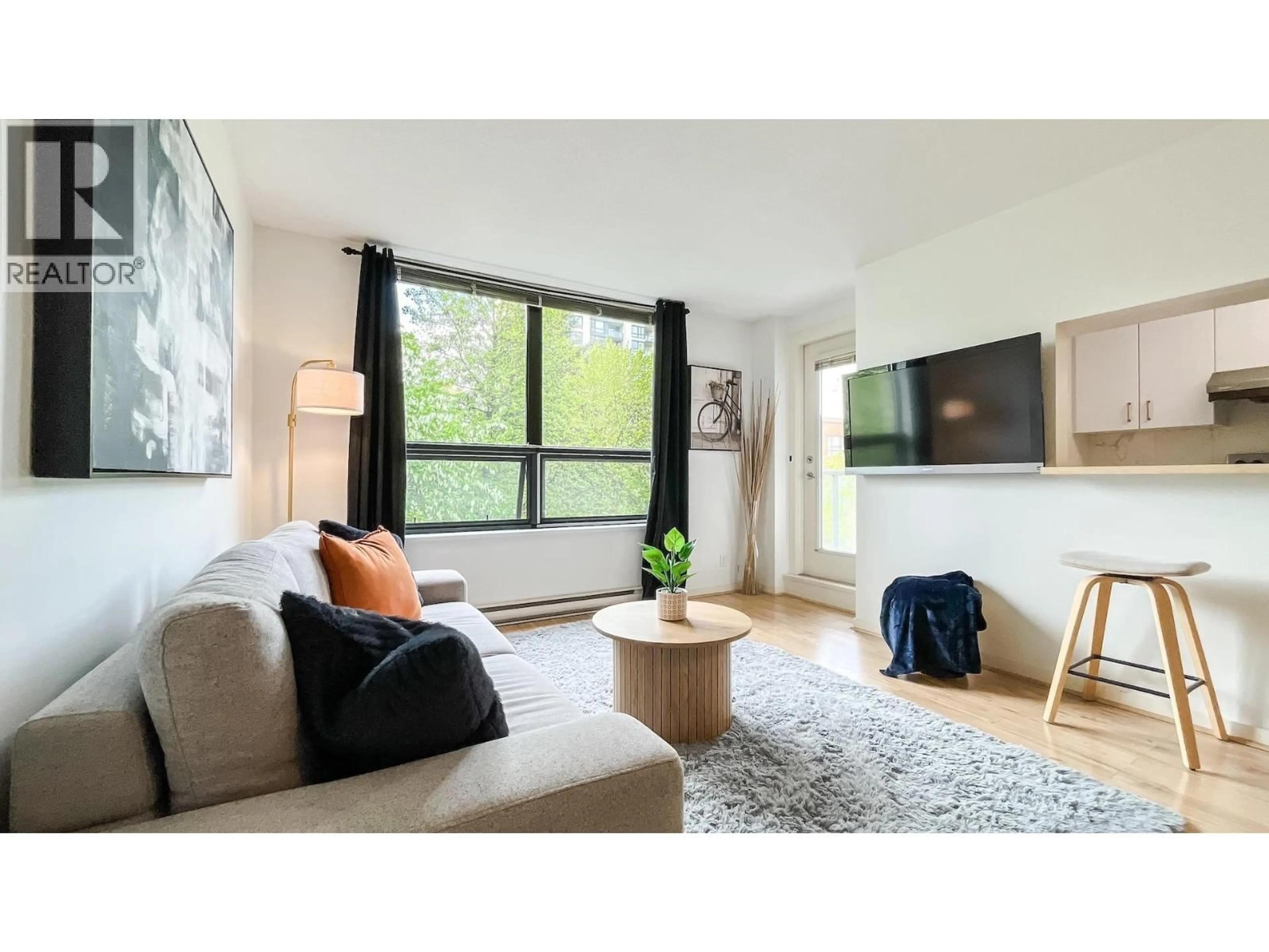 Living room with furniture, wood/laminate floor for 305 - 3638 VANNESS AVENUE, Vancouver British Columbia V5R6H6