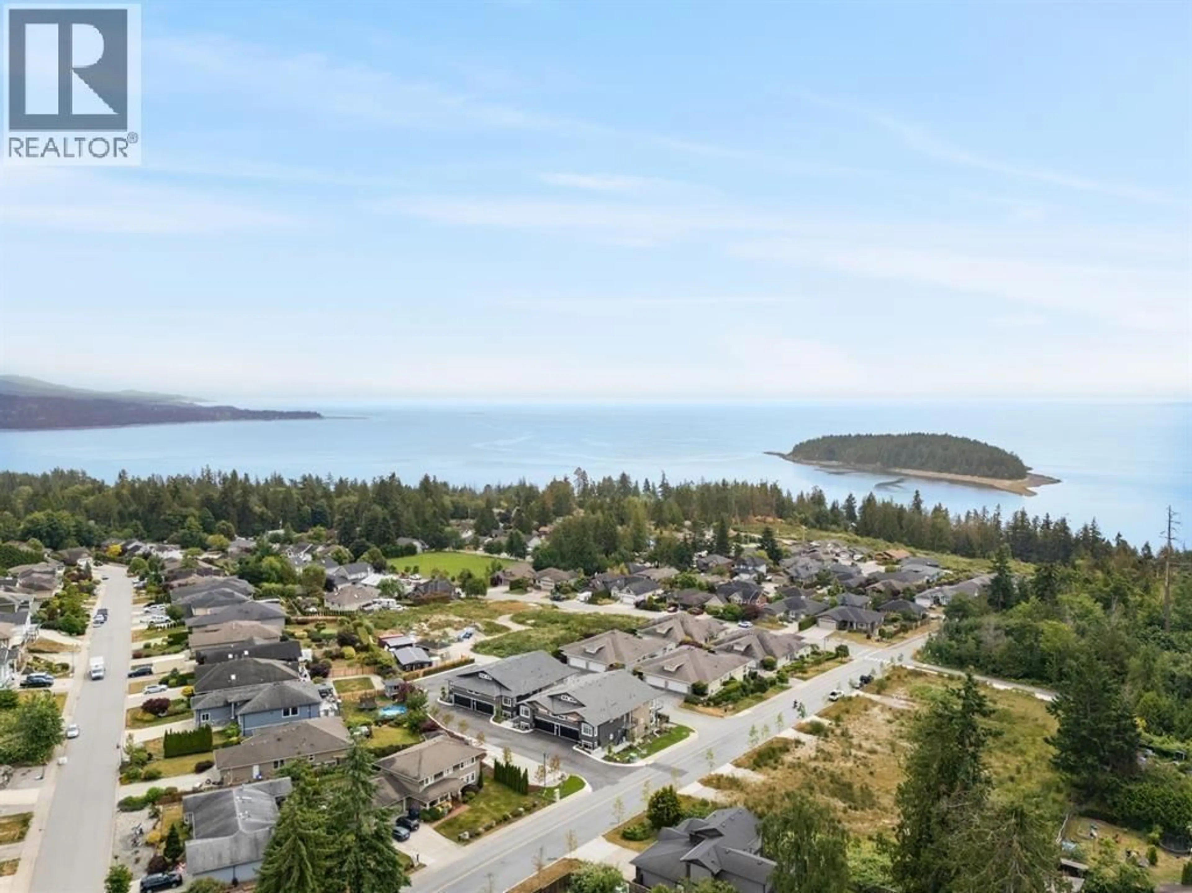 A pic from outside/outdoor area/front of a property/back of a property/a pic from drone, water/lake/river/ocean view for 2 - 5522 MCCOURT ROAD, Sechelt British Columbia V7Z1H5