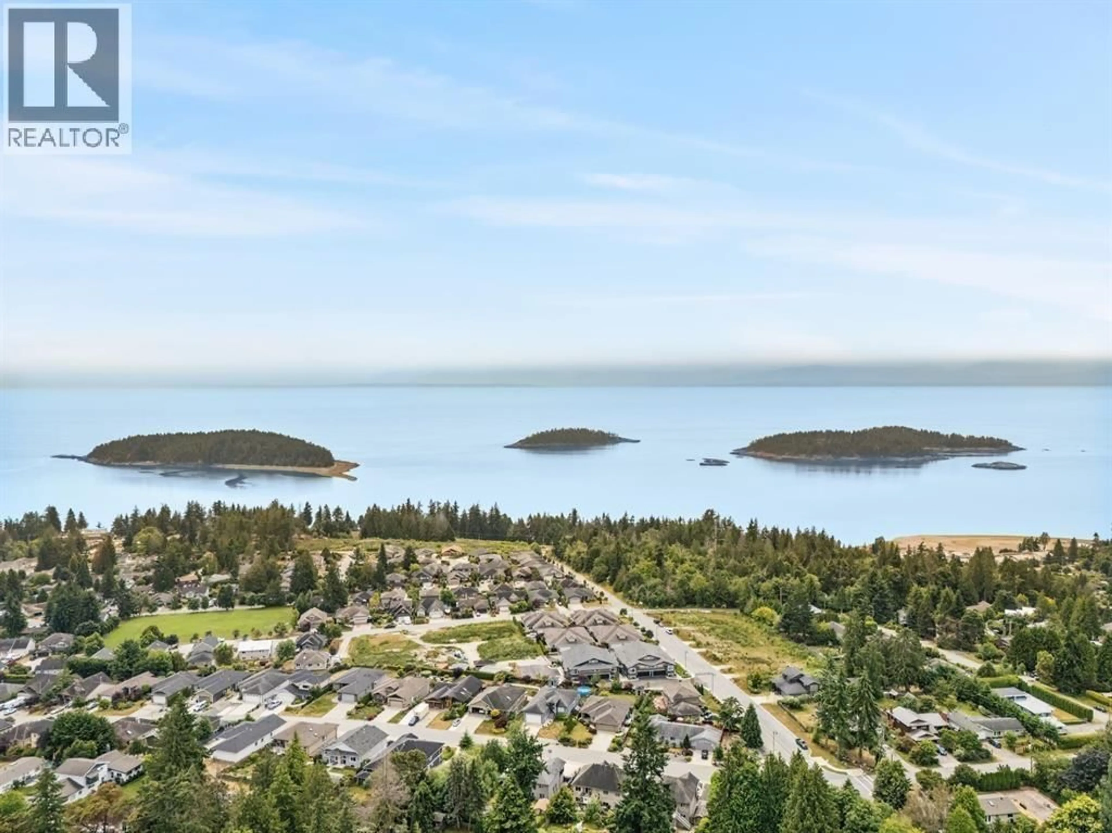 A pic from outside/outdoor area/front of a property/back of a property/a pic from drone, water/lake/river/ocean view for 2 - 5522 MCCOURT ROAD, Sechelt British Columbia V7Z1H5
