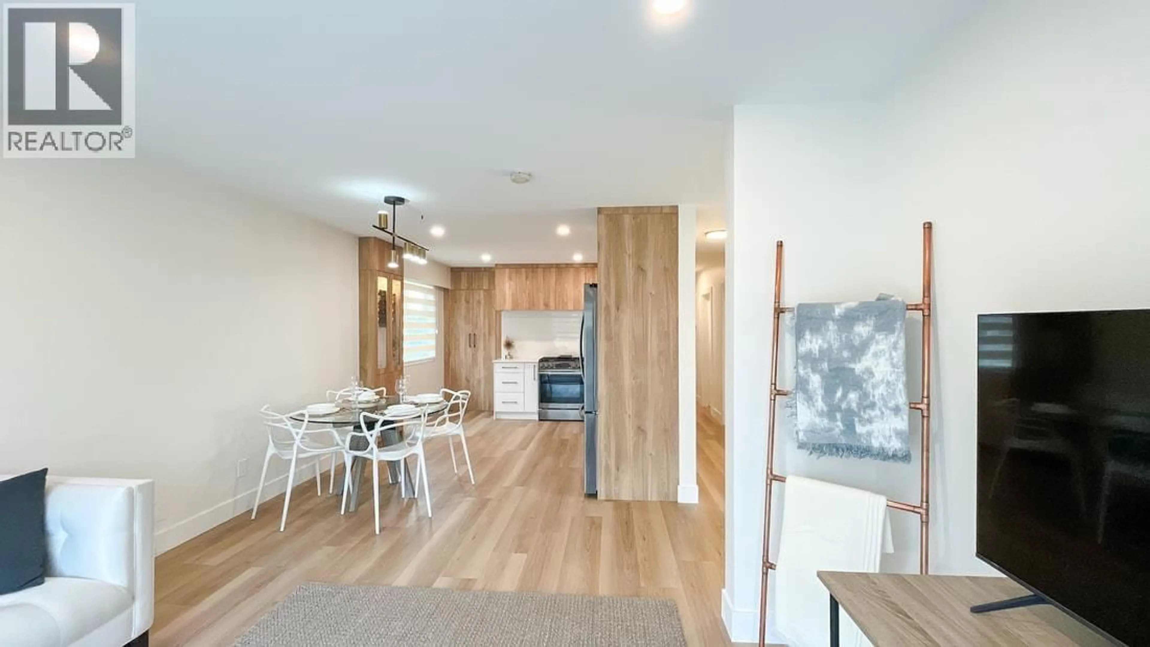 Open concept kitchen, wood/laminate floor for 320 57TH AVENUE, Vancouver British Columbia V5X1S7