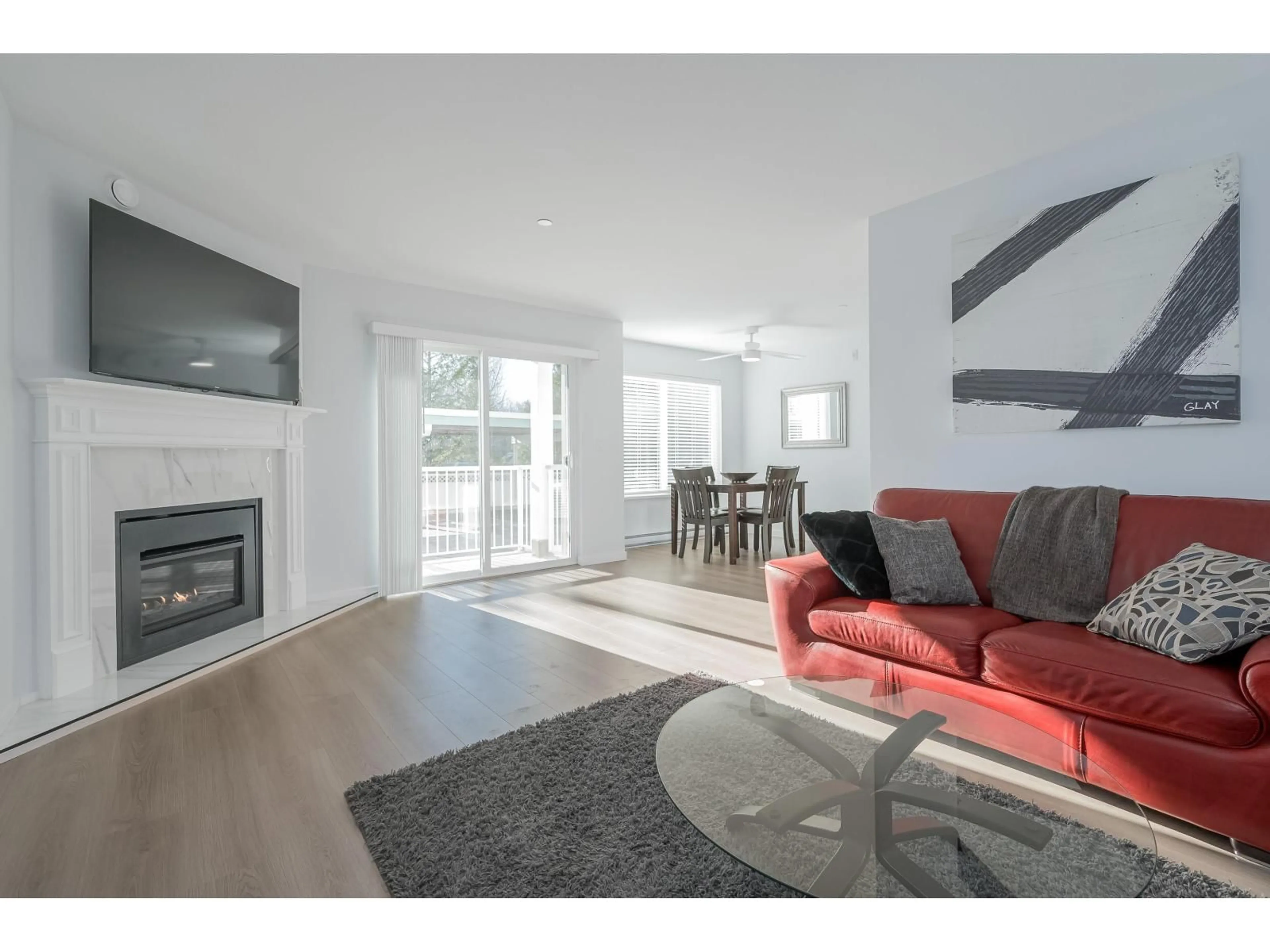 Living room with furniture, wood/laminate floor for 101 - 7265 HAIG STREET, Mission British Columbia V2V6N3