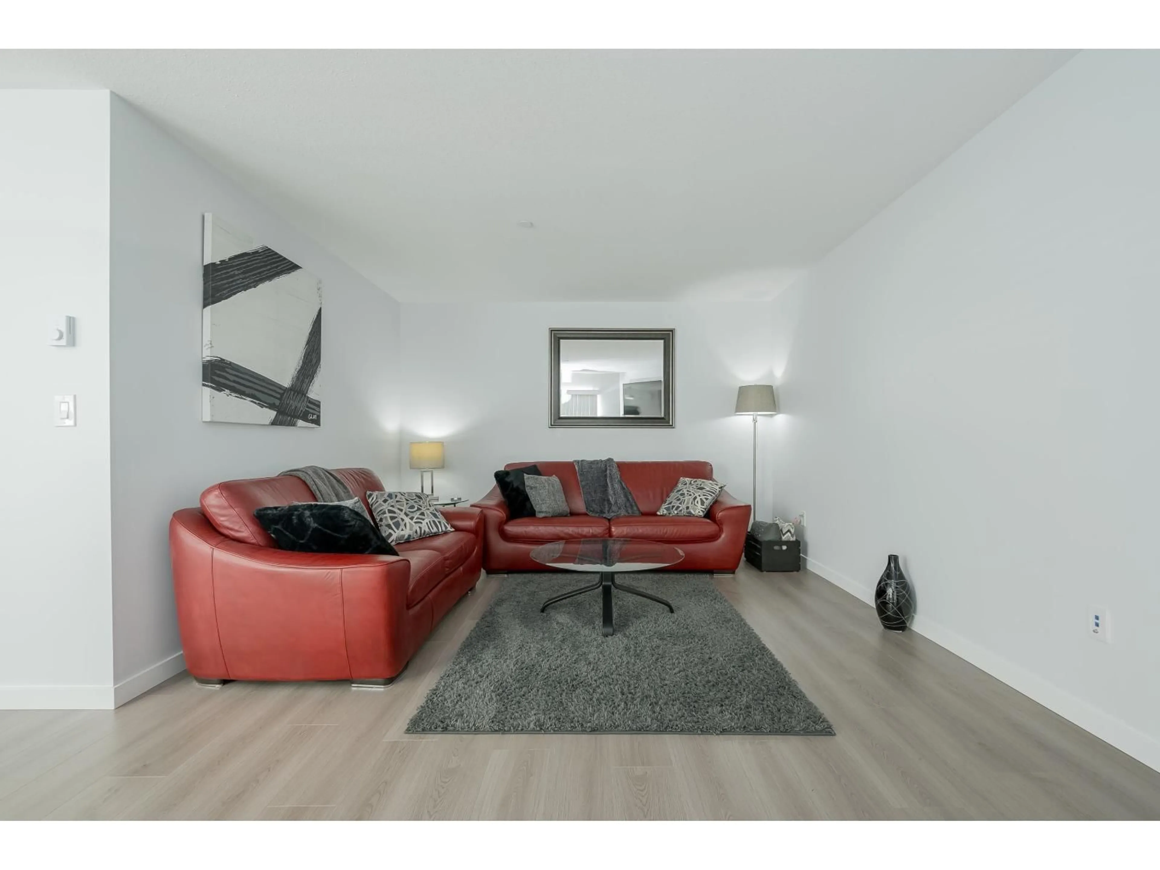 Living room with furniture, wood/laminate floor for 101 - 7265 HAIG STREET, Mission British Columbia V2V6N3