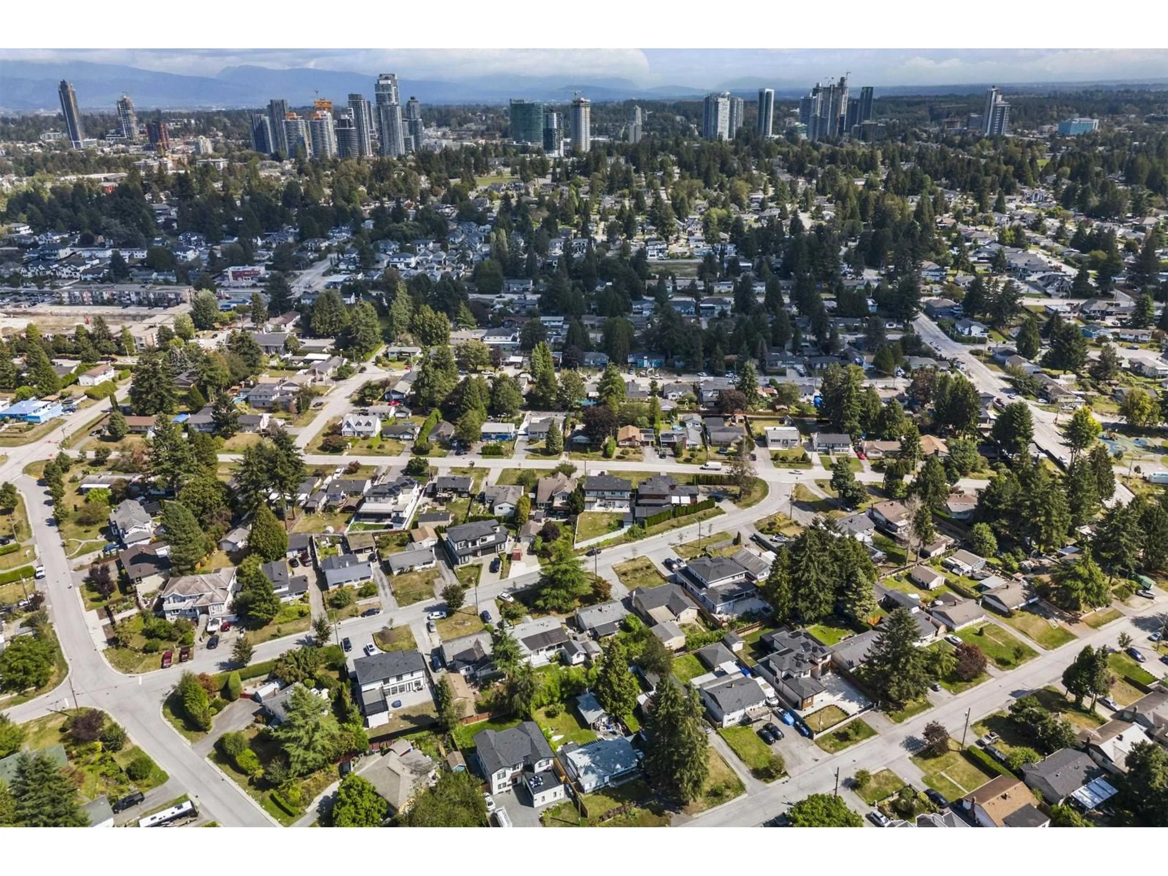 A pic from outside/outdoor area/front of a property/back of a property/a pic from drone, street for 10096 HELEN DRIVE, Surrey British Columbia V3V3B2