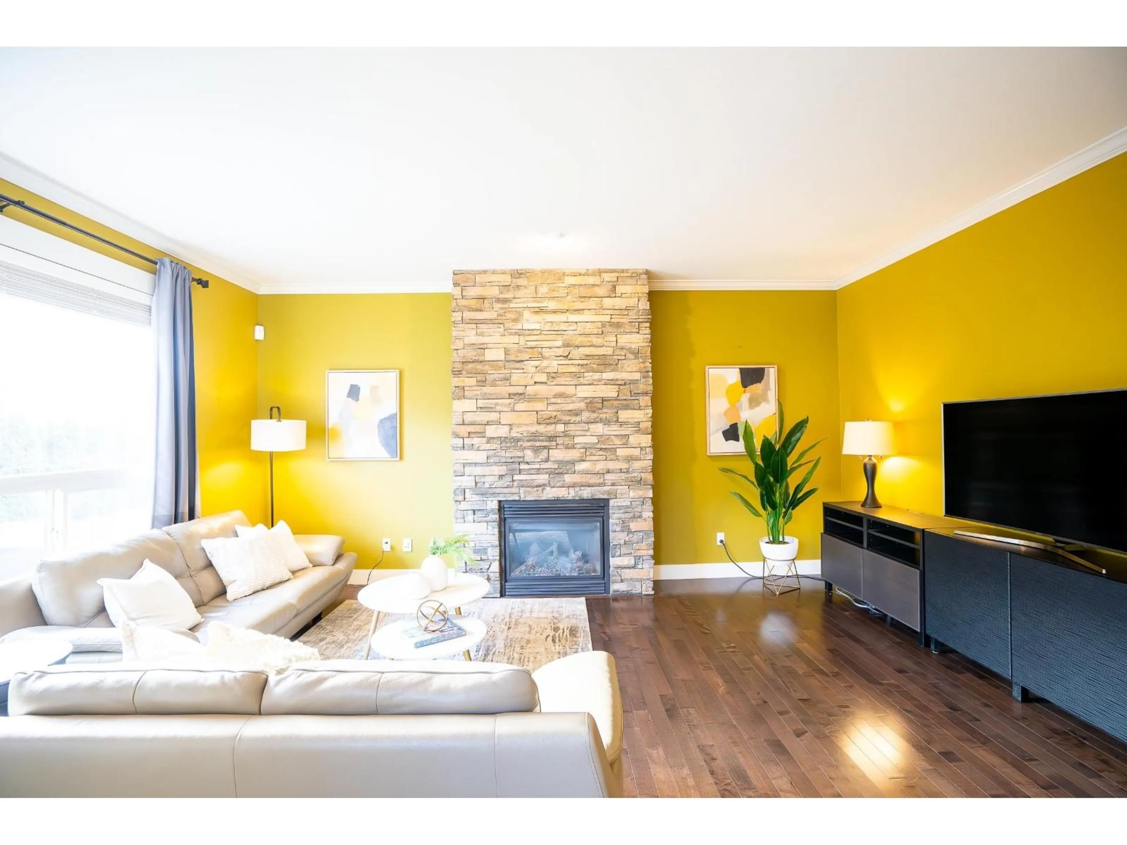Living room with furniture, wood/laminate floor for 17916 71 AVENUE, Surrey British Columbia V3S7C7