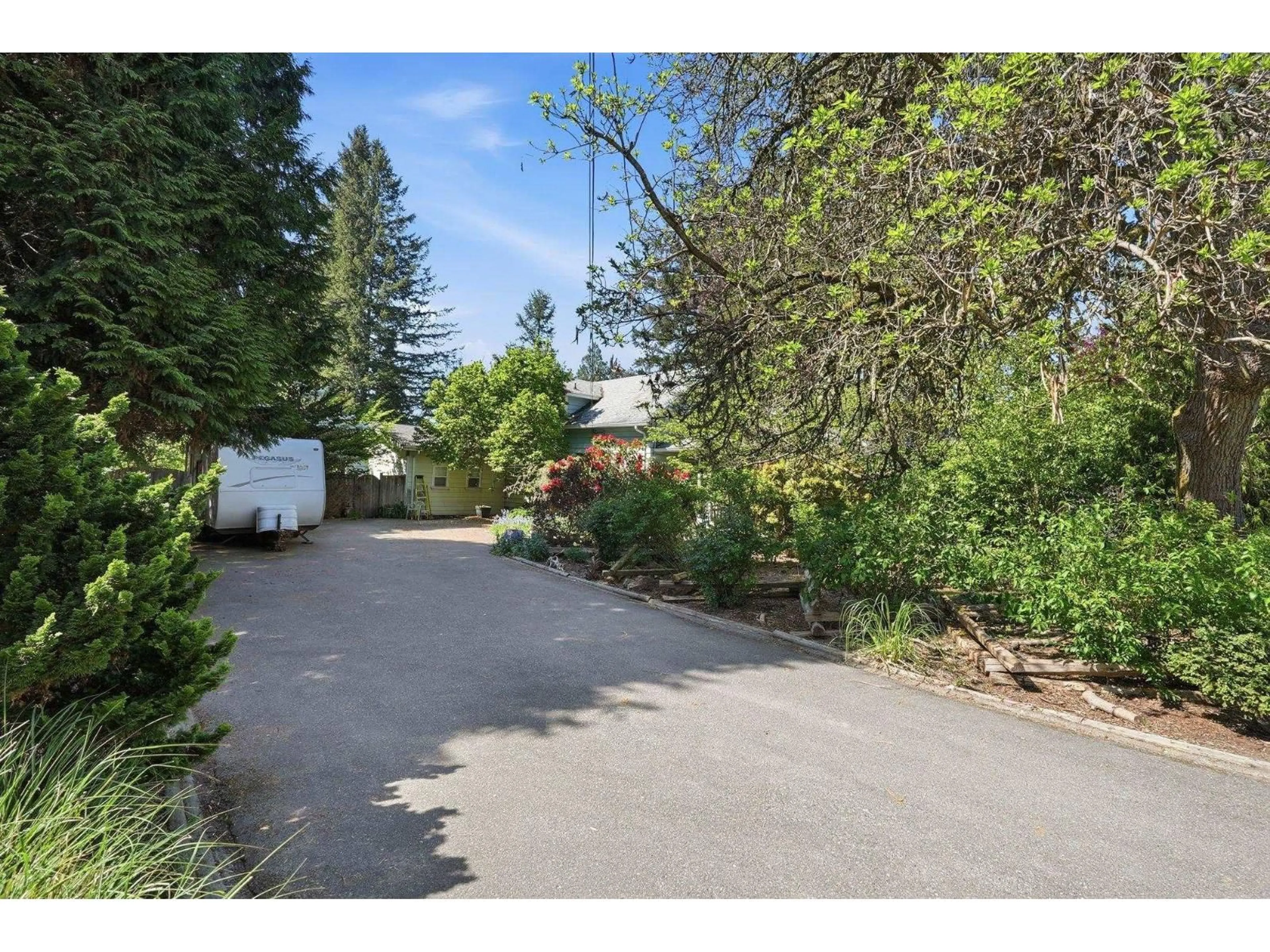A pic from outside/outdoor area/front of a property/back of a property/a pic from drone, street for 8983 TRATTLE STREET, Langley British Columbia V1M2R6