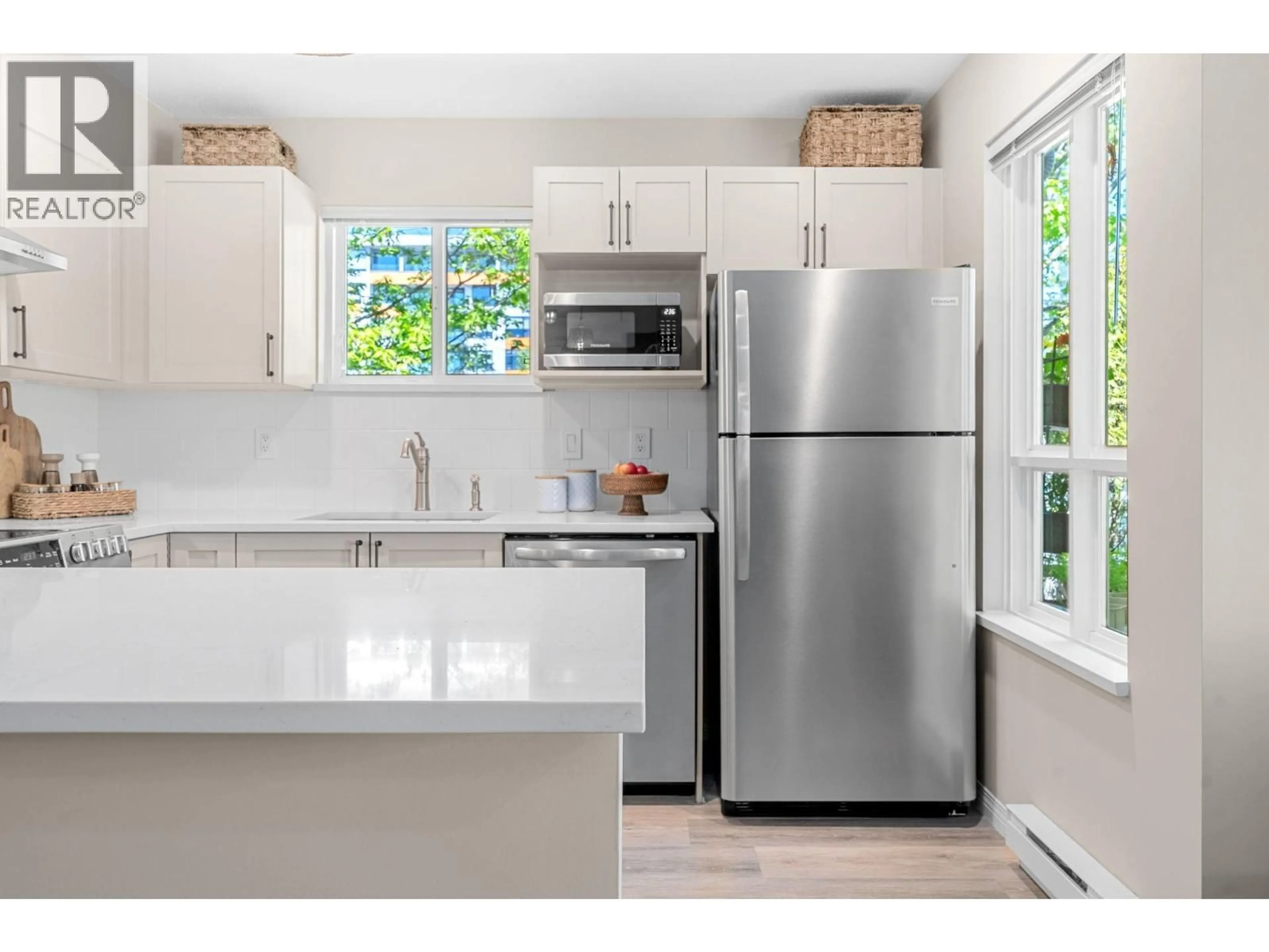 Open concept kitchen, ceramic/tile floor for 303 - 365 1ST STREET, North Vancouver British Columbia V7L4W5