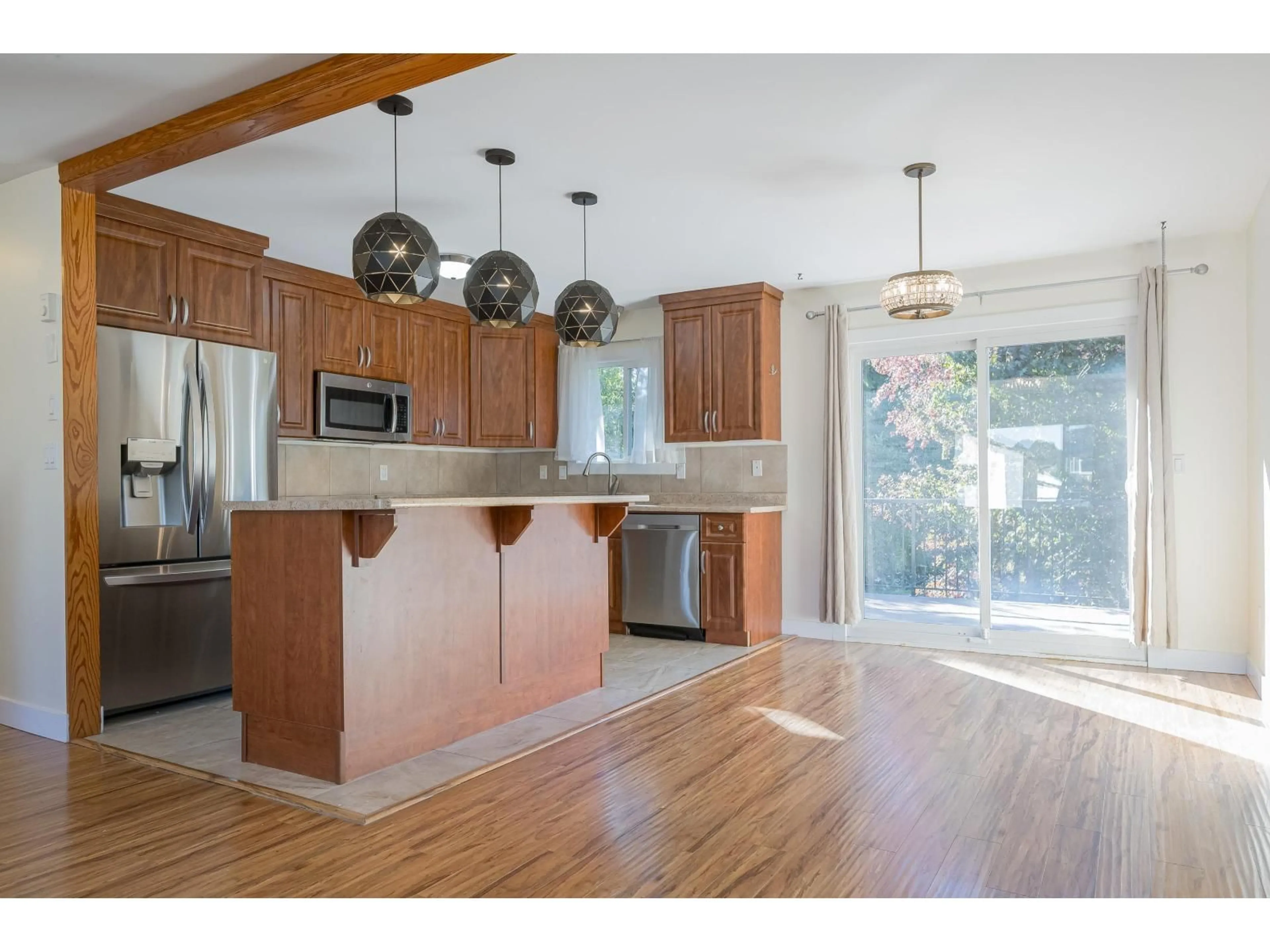 Open concept kitchen, wood/laminate floor for 8558 MCCUTCHEON AVENUE, Chilliwack British Columbia V2P7K7