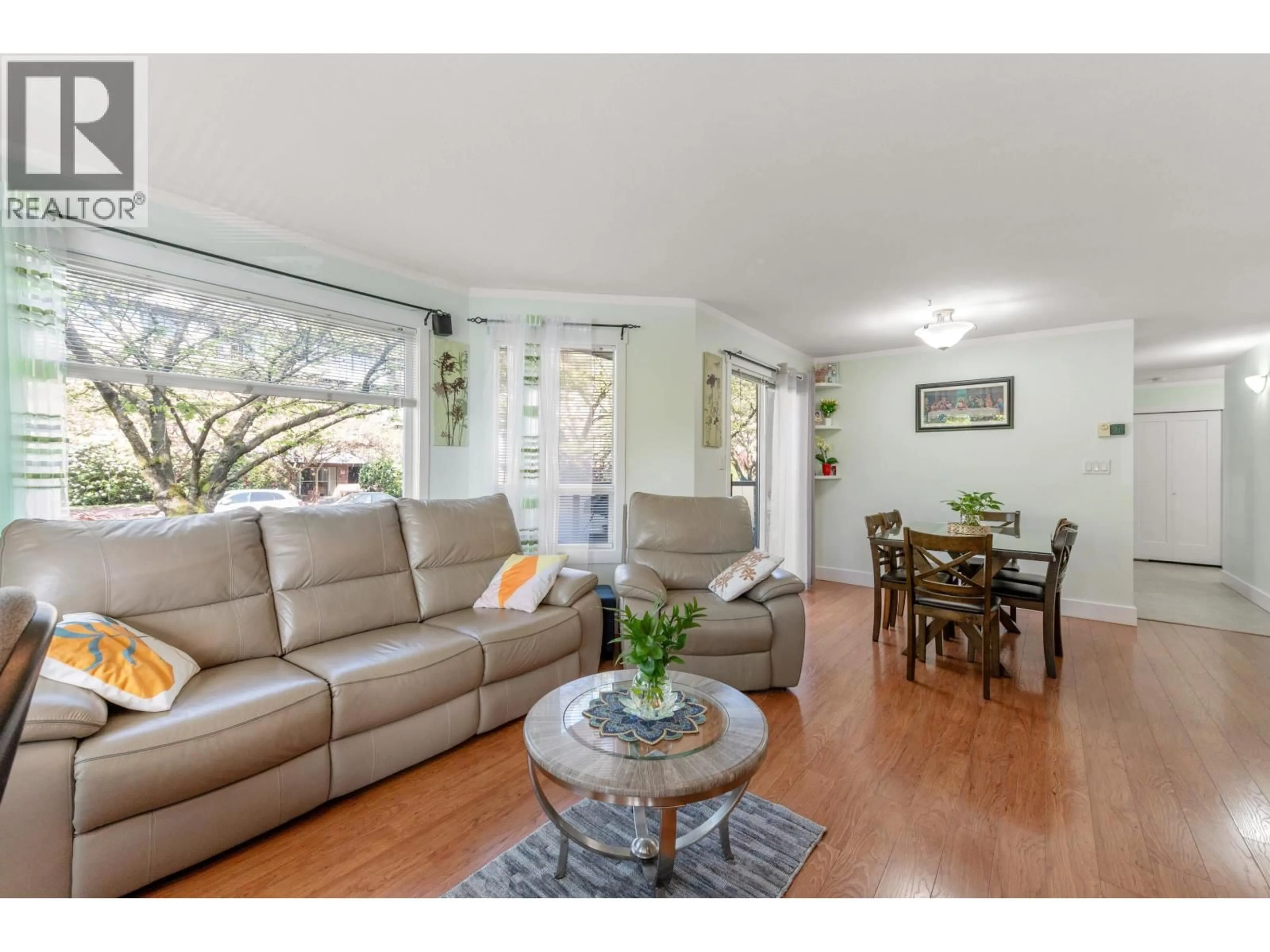Living room with furniture, wood/laminate floor for 201 - 175 4TH STREET, North Vancouver British Columbia V7M1H6