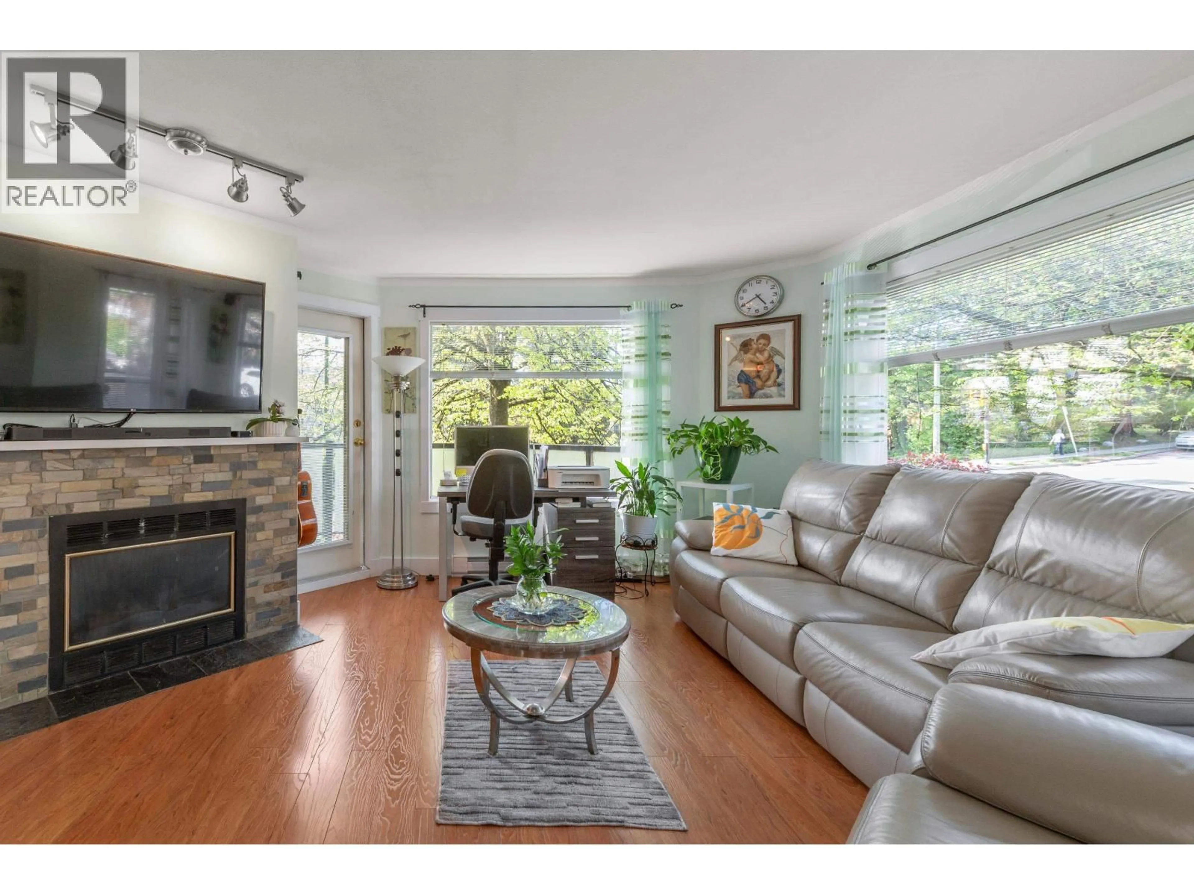 Living room with furniture, wood/laminate floor for 201 - 175 4TH STREET, North Vancouver British Columbia V7M1H6