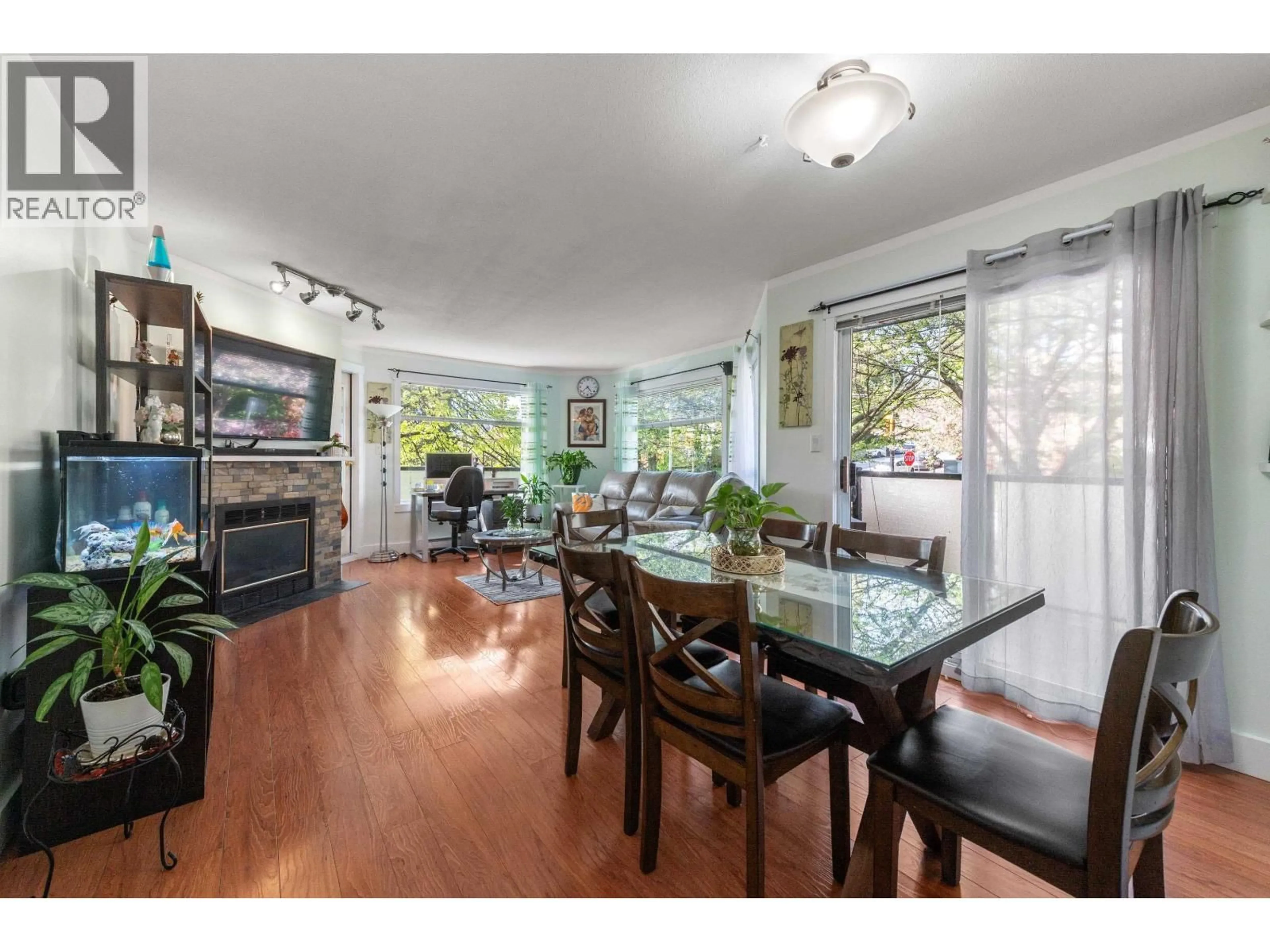 Dining room, wood/laminate floor for 201 - 175 4TH STREET, North Vancouver British Columbia V7M1H6