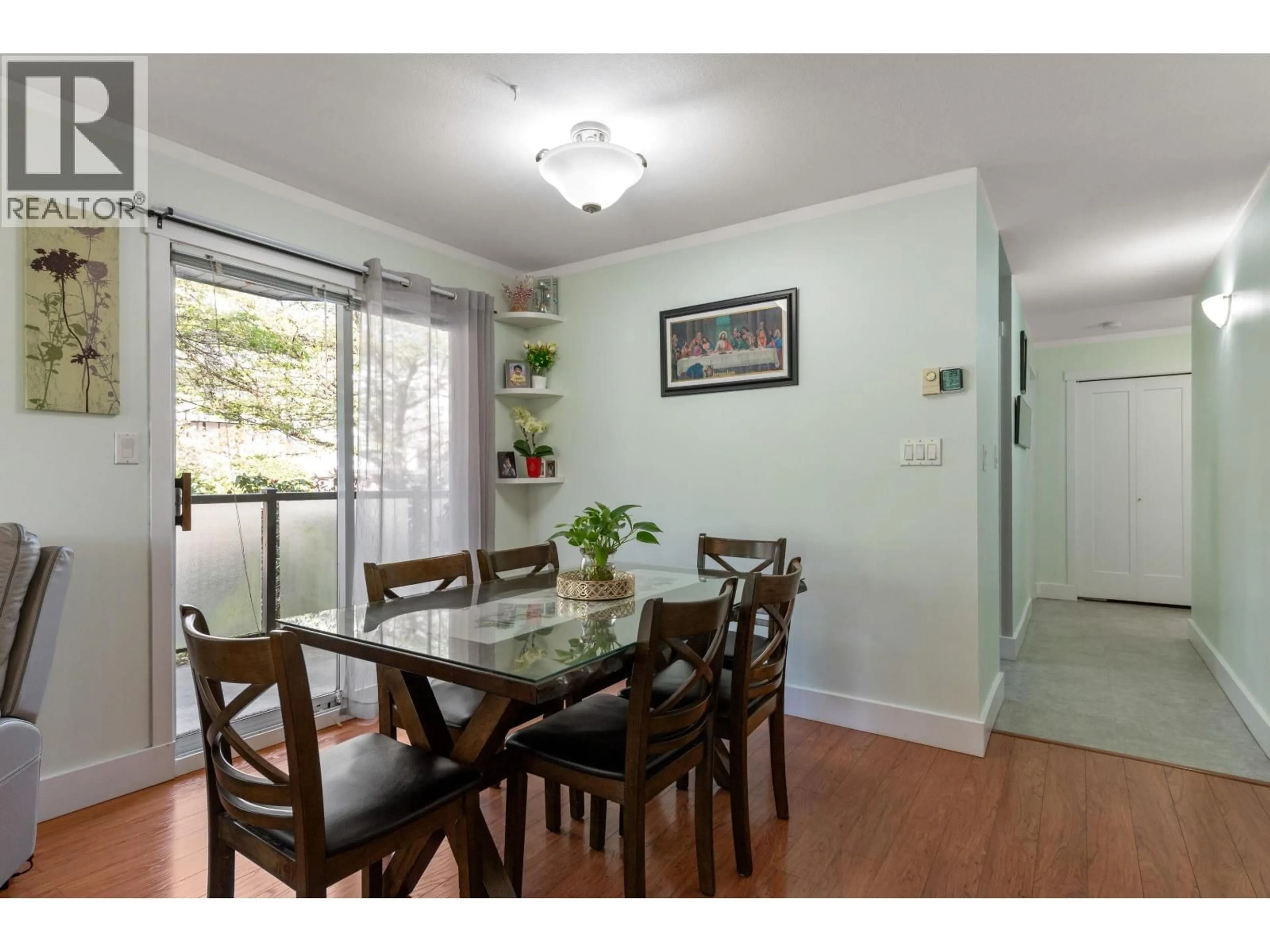 Dining room, wood/laminate floor for 201 - 175 4TH STREET, North Vancouver British Columbia V7M1H6